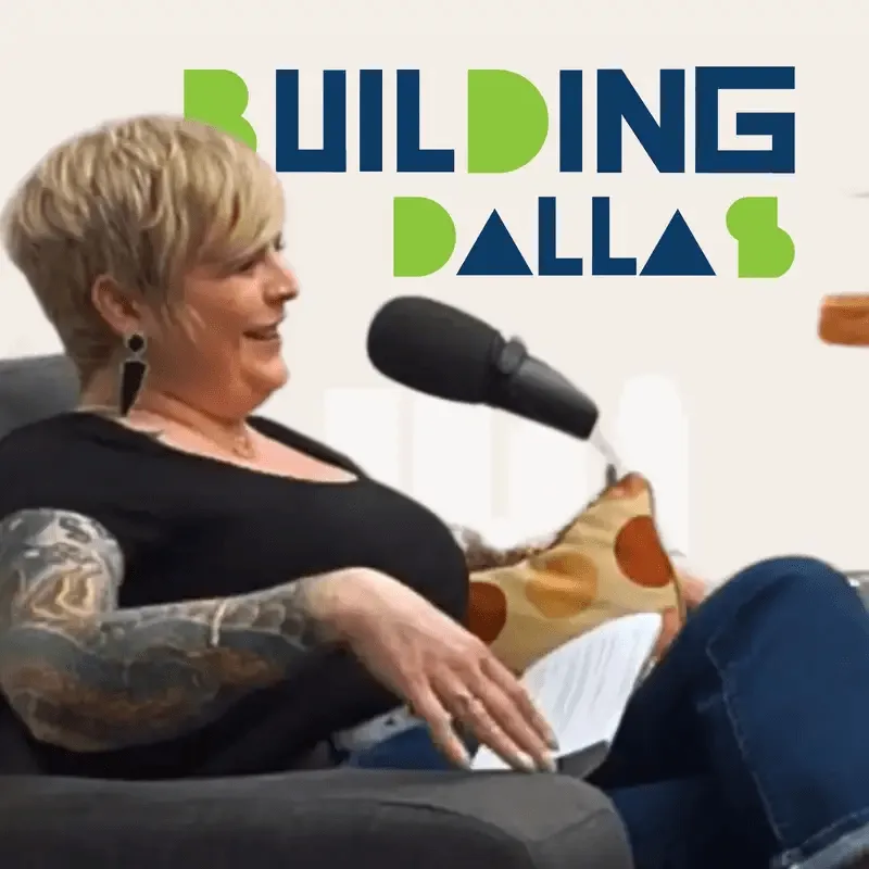 guest speaking into microphones with “Building Dallas” branding