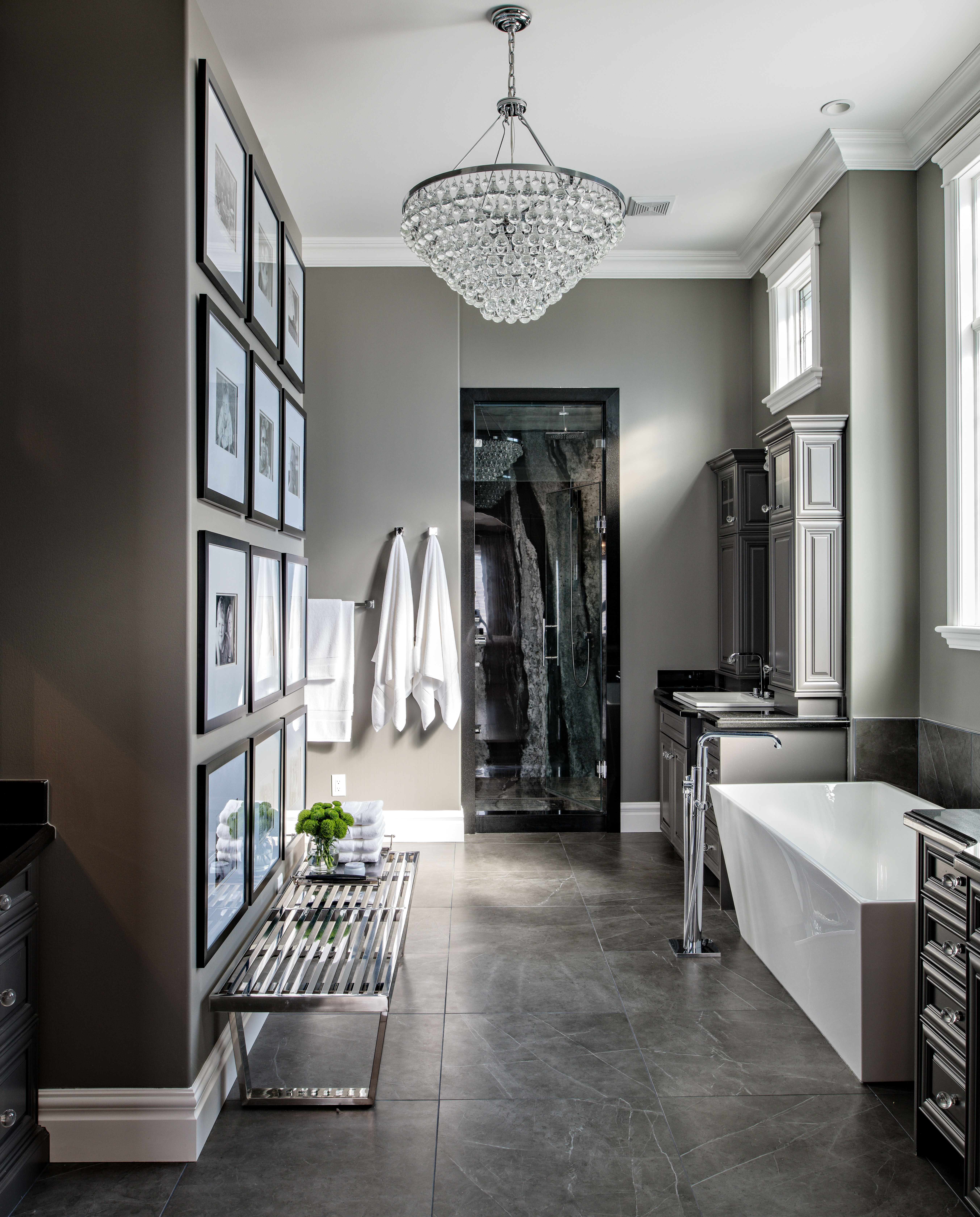 Image of luxurious moody primary ensuite with dark features.