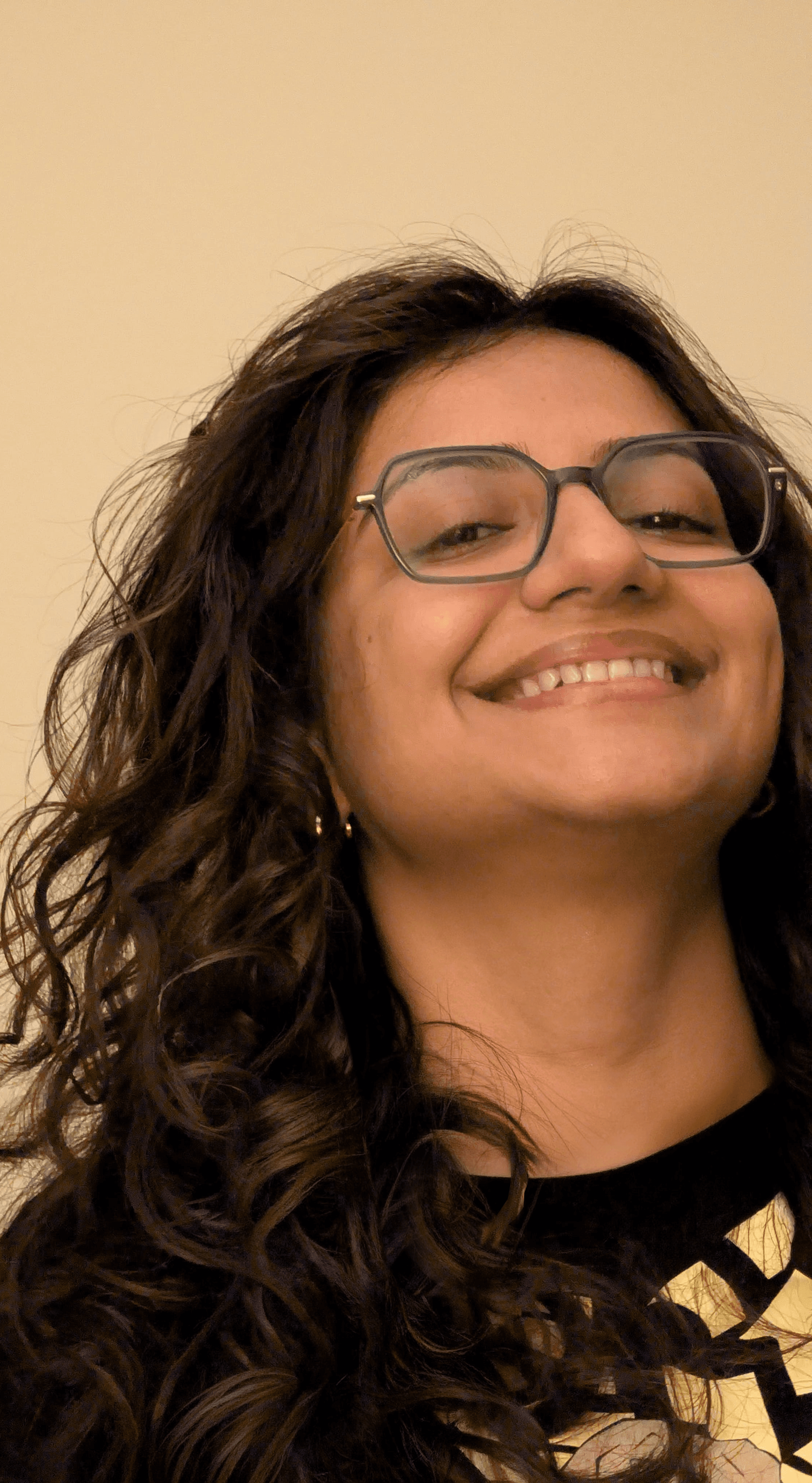 Portrait of a person in dark clothing speaking on a phone