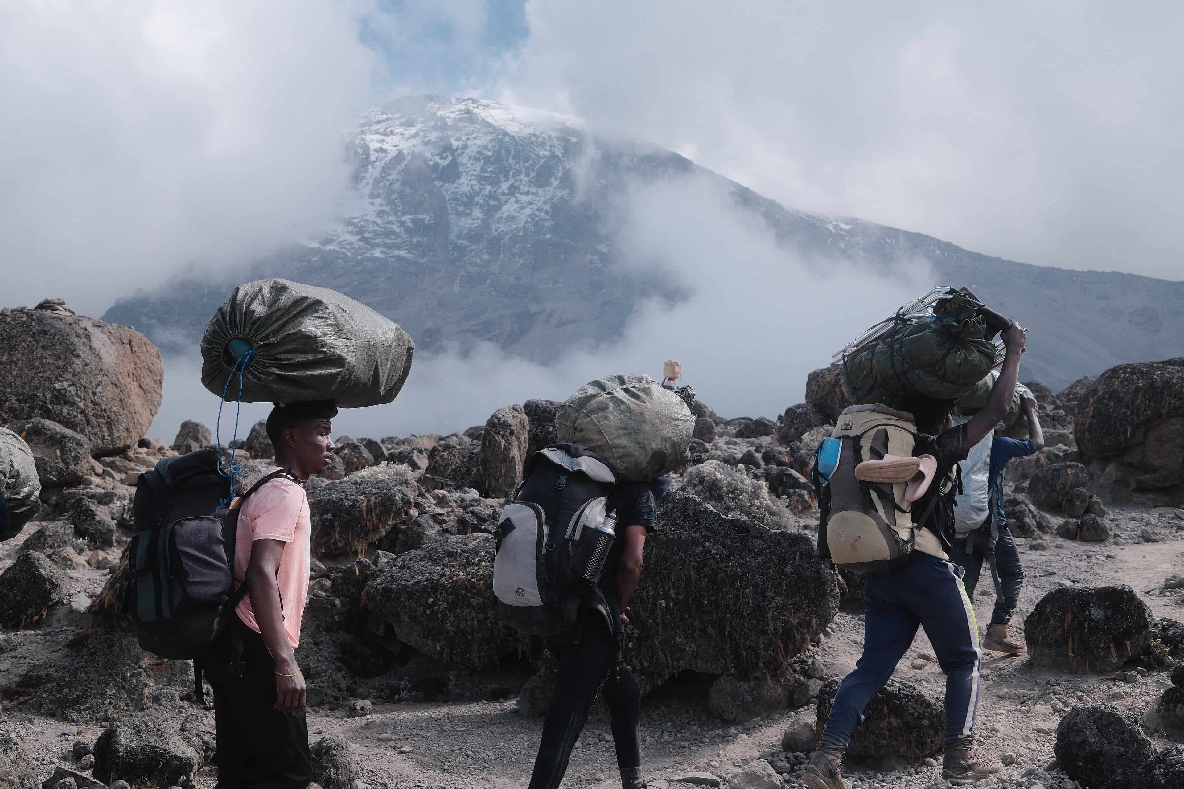 Legend Expeditions crew clearing camp waste on Kilimanjaro descent