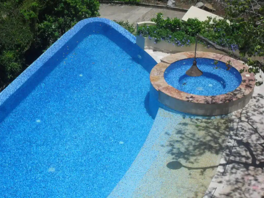 Pool with a raised spa, the floor graded from blue to sand — Mosaiclegs Art Studio