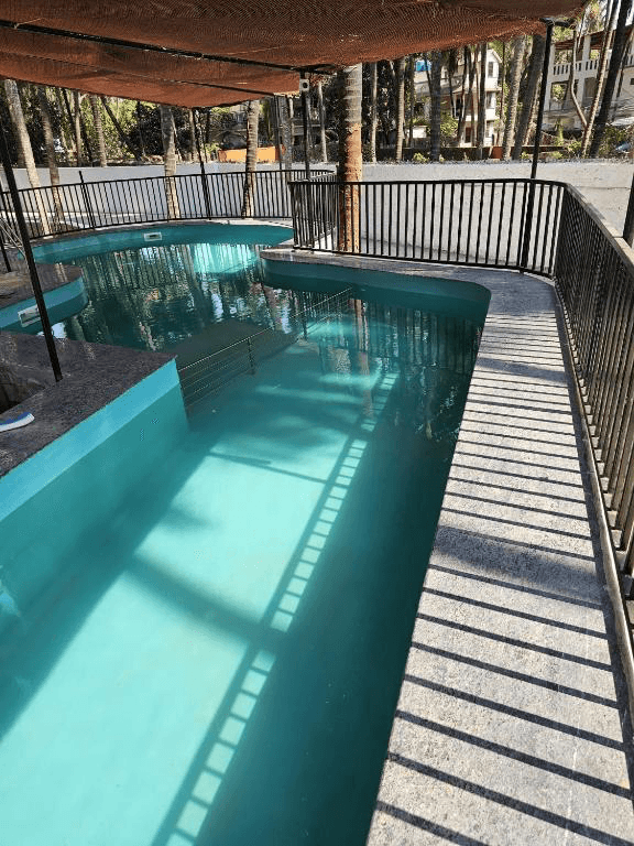 Swimming pool at Wavelash Resort in Gorai.