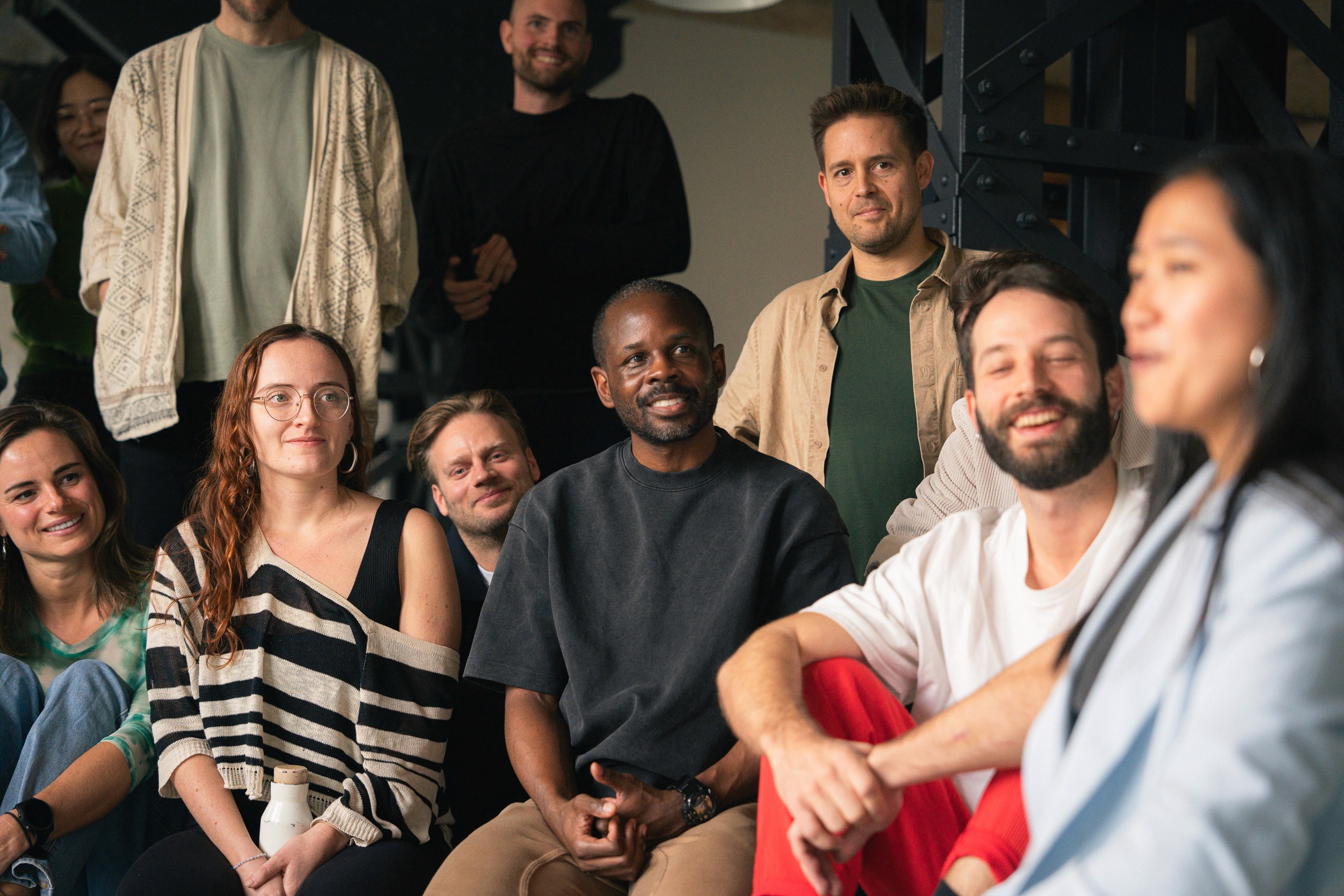 A crowd people dancing in a room