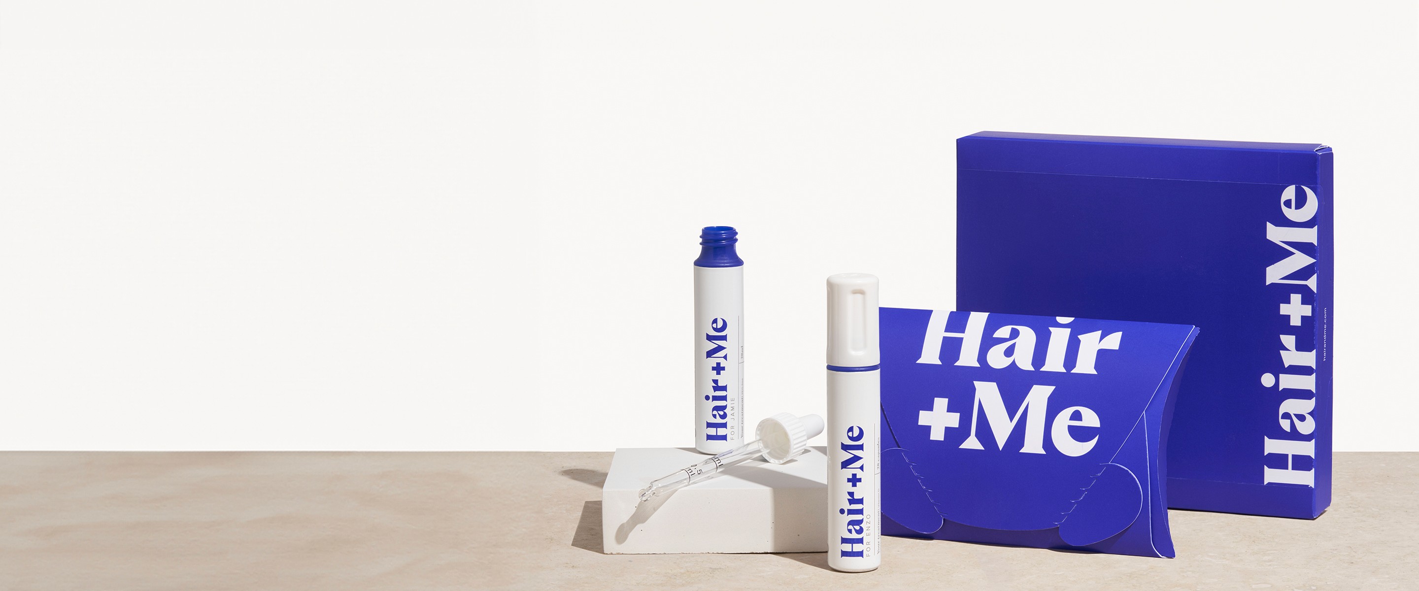 Image with products, The Capsules and The Drops dispayed with a pillow box. There is also a "featured in vogue" badge.