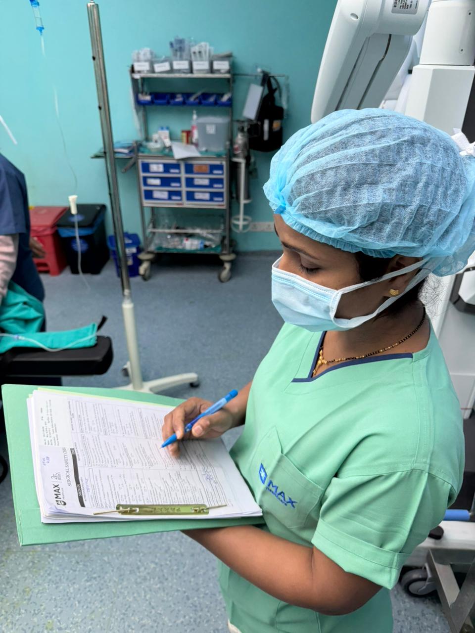 Anesthetist taking report of the patient during surgery.