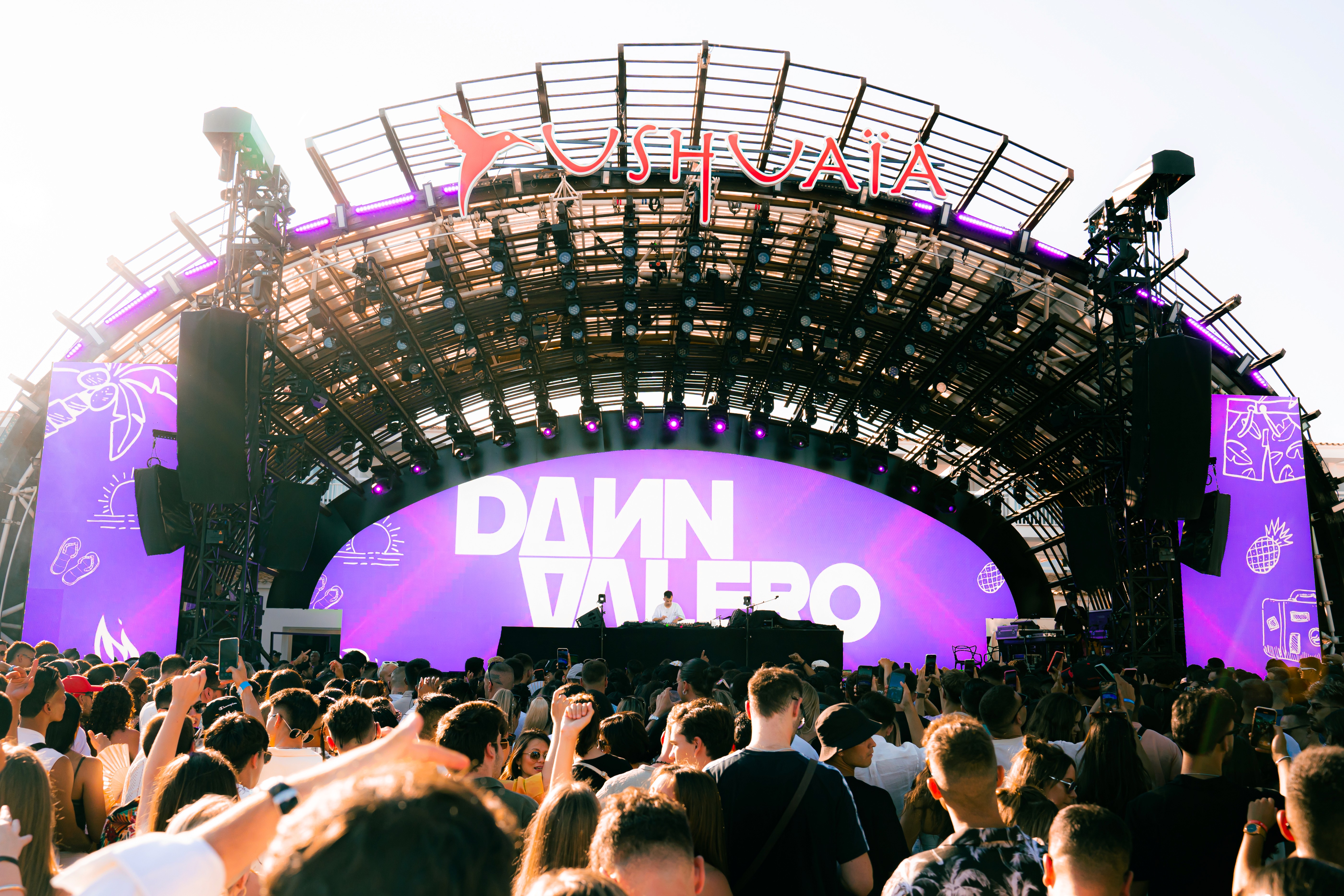 A man wearing a virtual reality headset, immersed in a digital experience, with a focused expression on her face.
