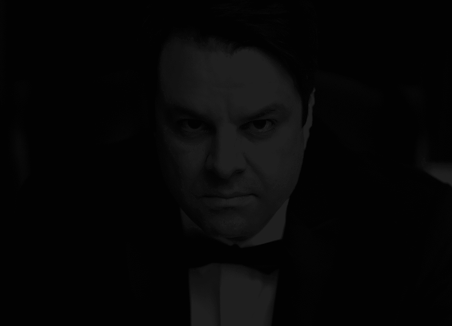 Extreme close-up black and white photograph of a human eye