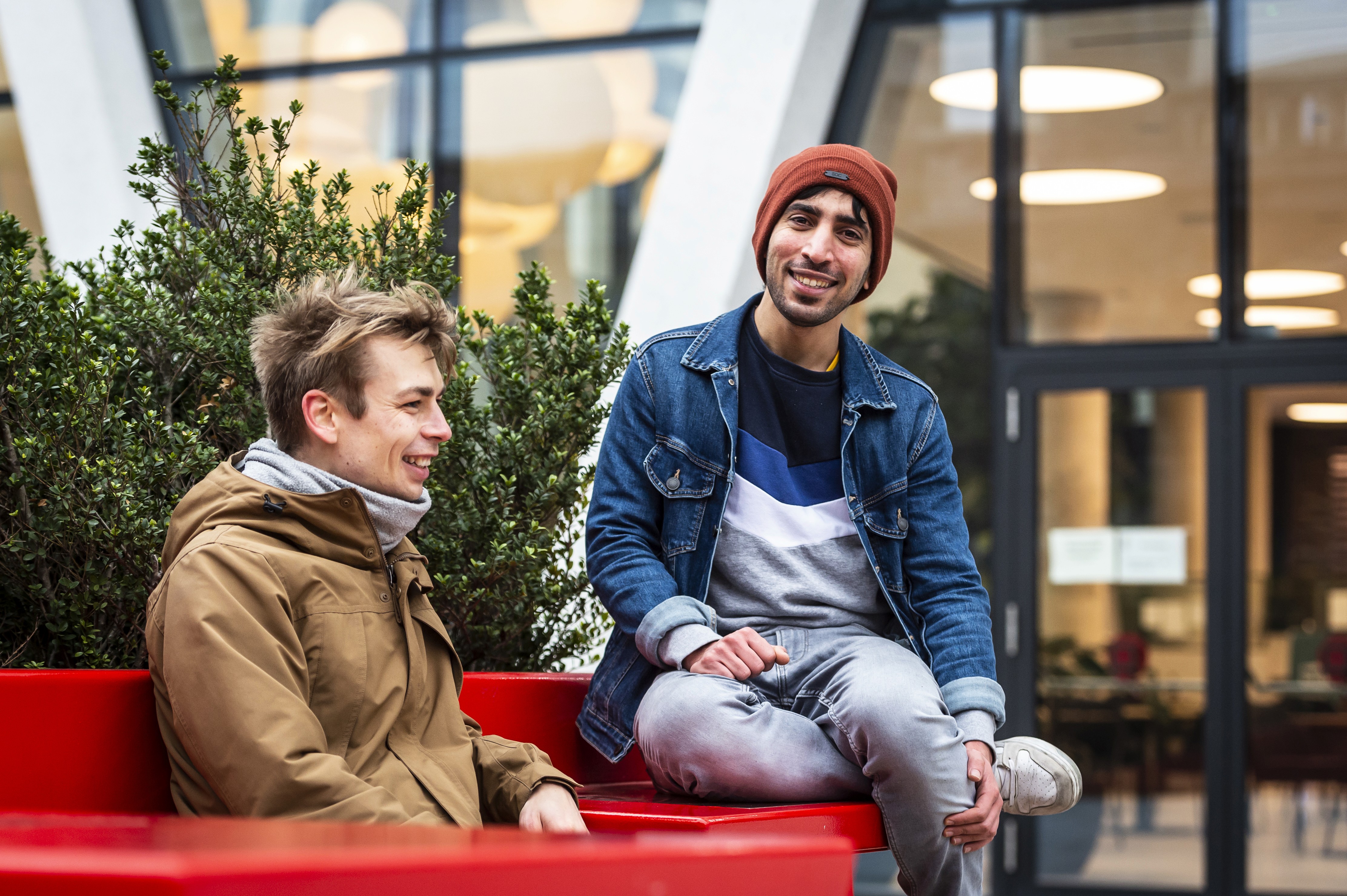 people holding miniature figures