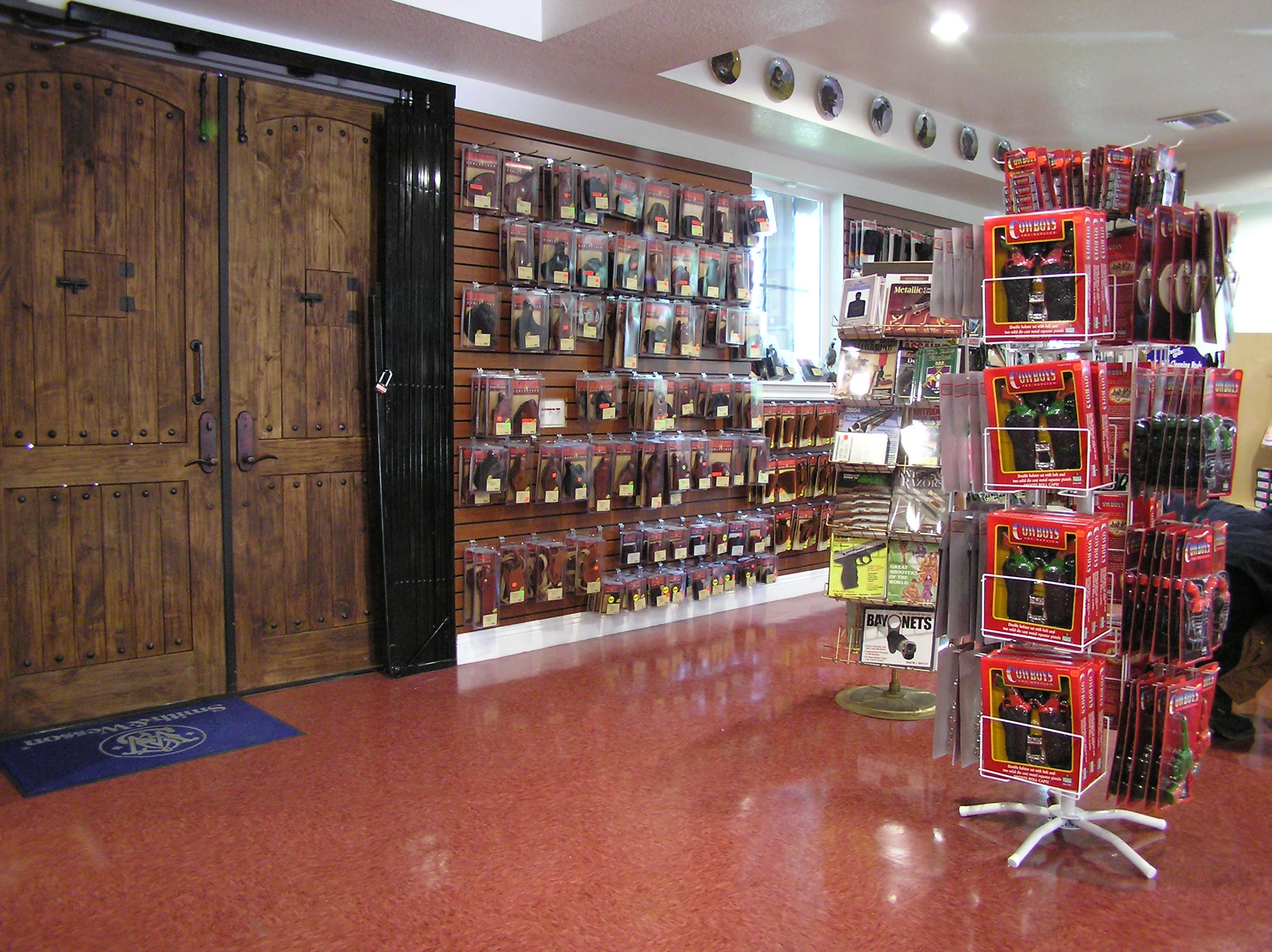 Gun racks showcasing the shop's product offerings in a well-organized and visually appealing manner.