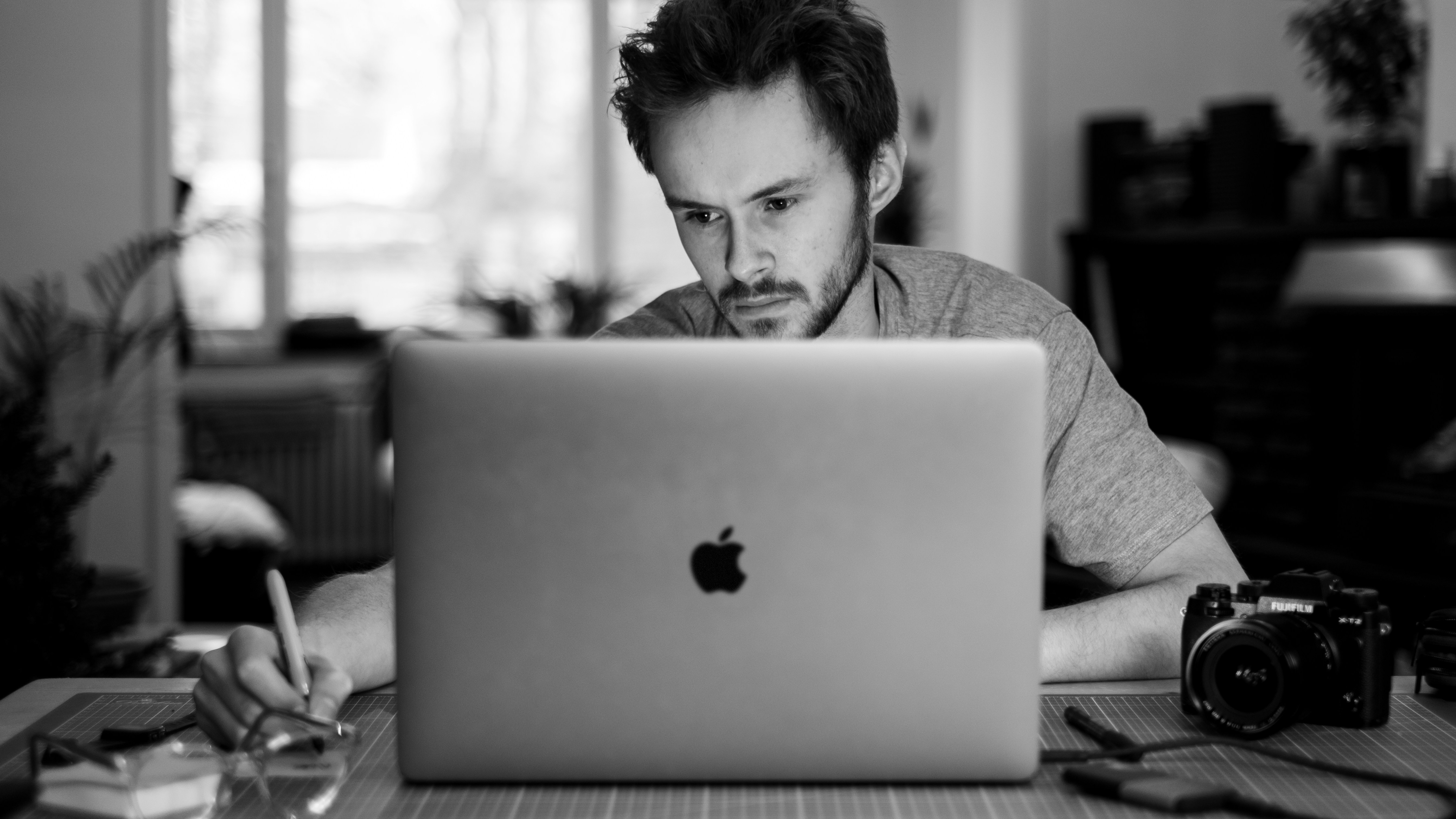 man being really focused on work - Free ChatGPT Alternative For Essays