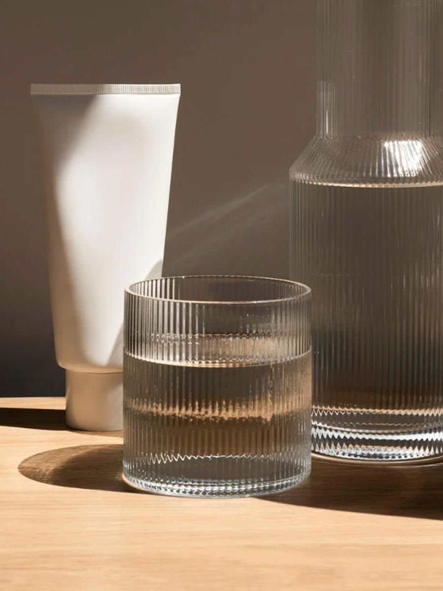 A vase and glass of water