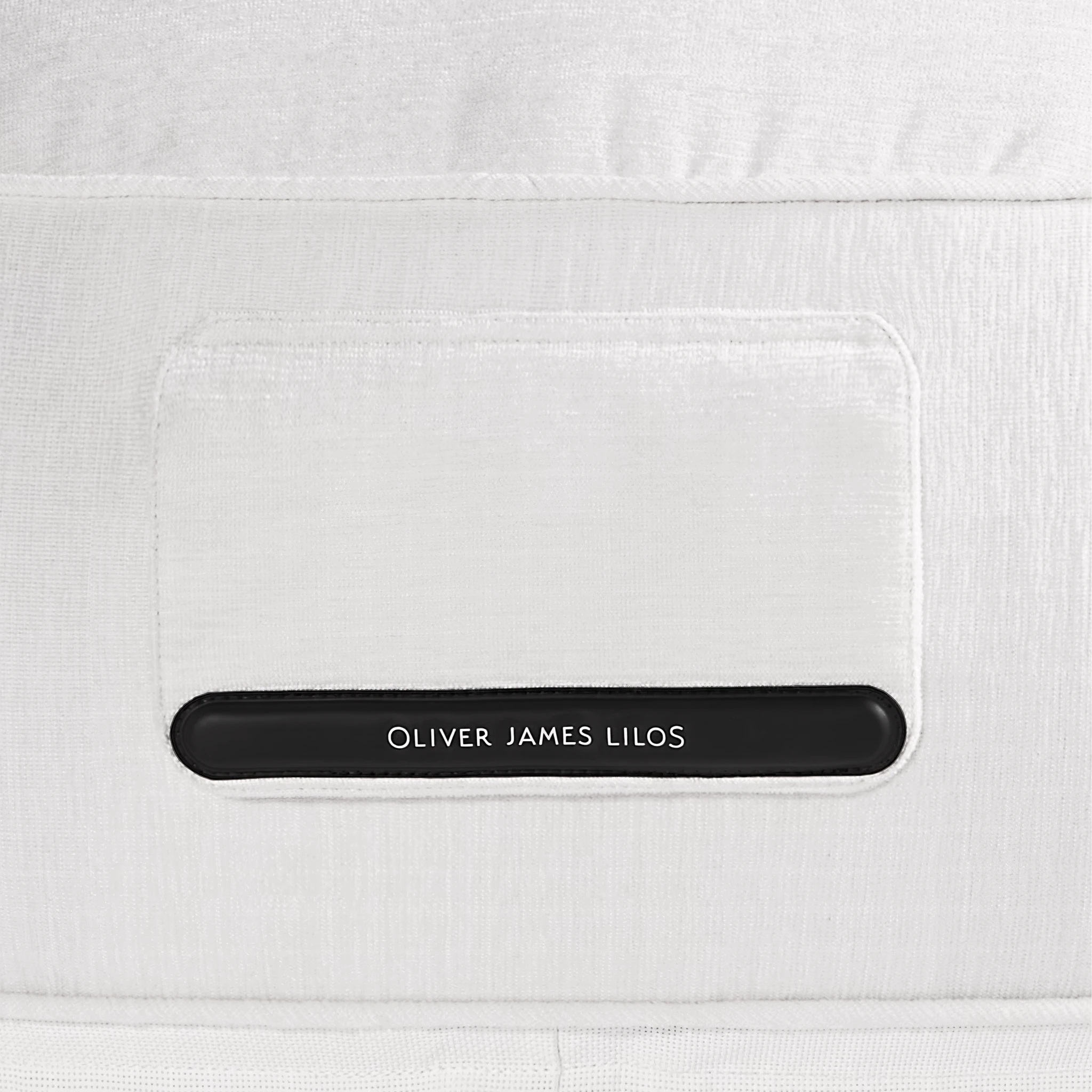 Oliver James Lilos branded patch stitched into the magnetic valve window — minimalist design for understated luxury.