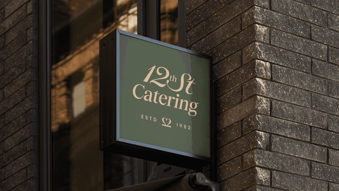 Black and white image of people working at a table with laptops, showing hands gesturing during discussion of digital content displayed on screens, with fabrica® logo in the corner.