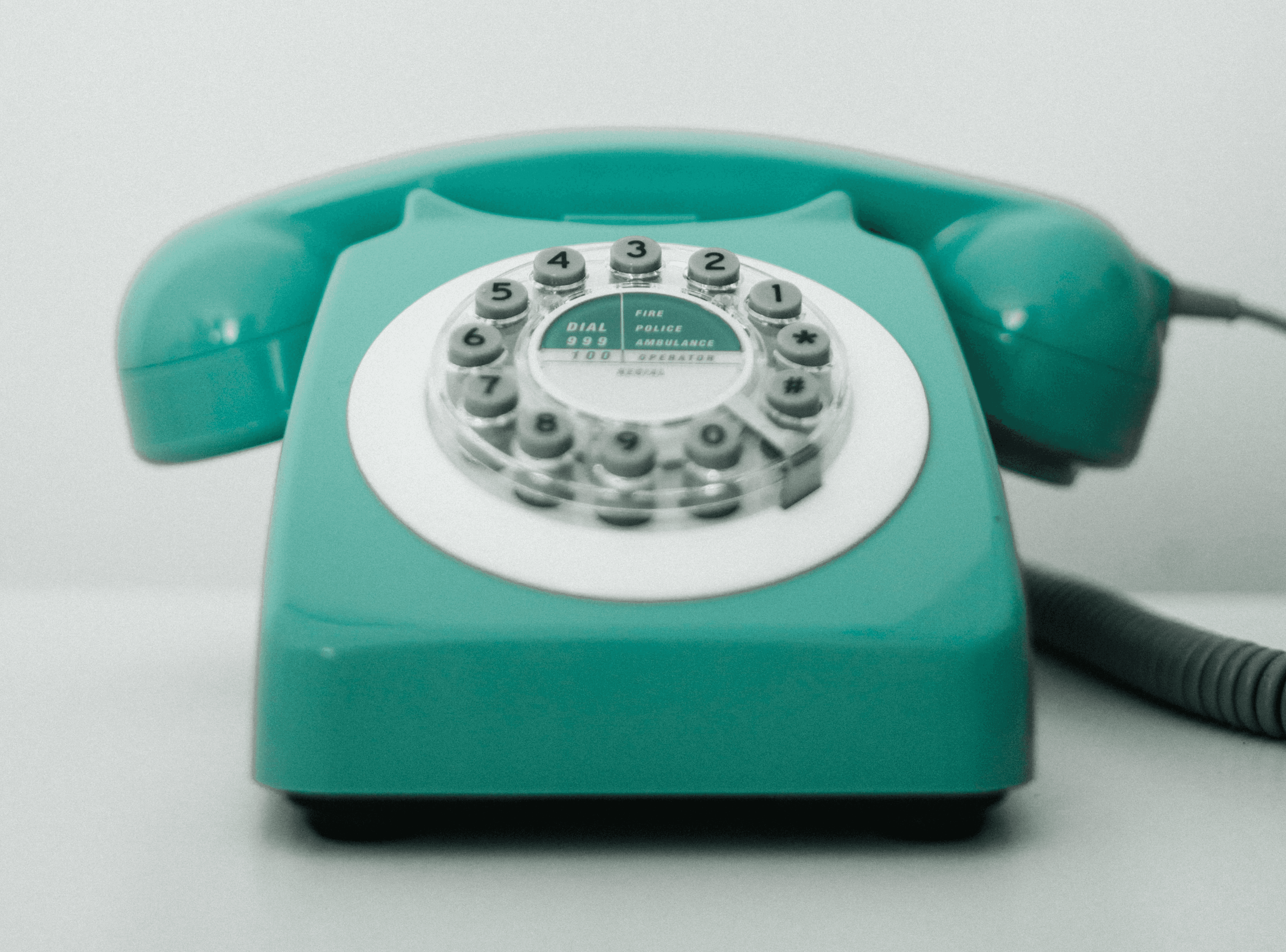 Image of old rotary phone by Diogo Brandao