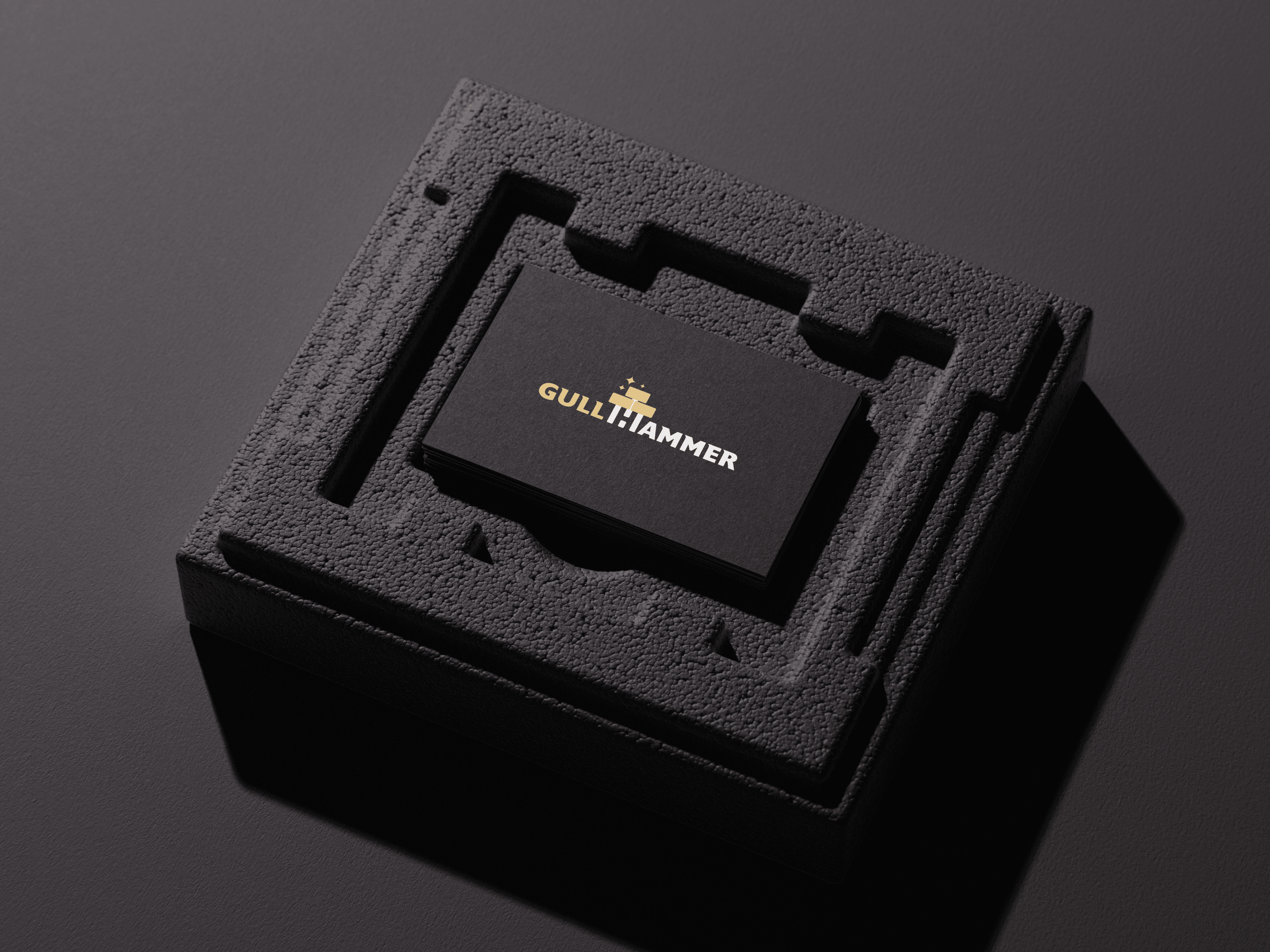 man wearing grey t-shirt standing in front of man sitting on chair