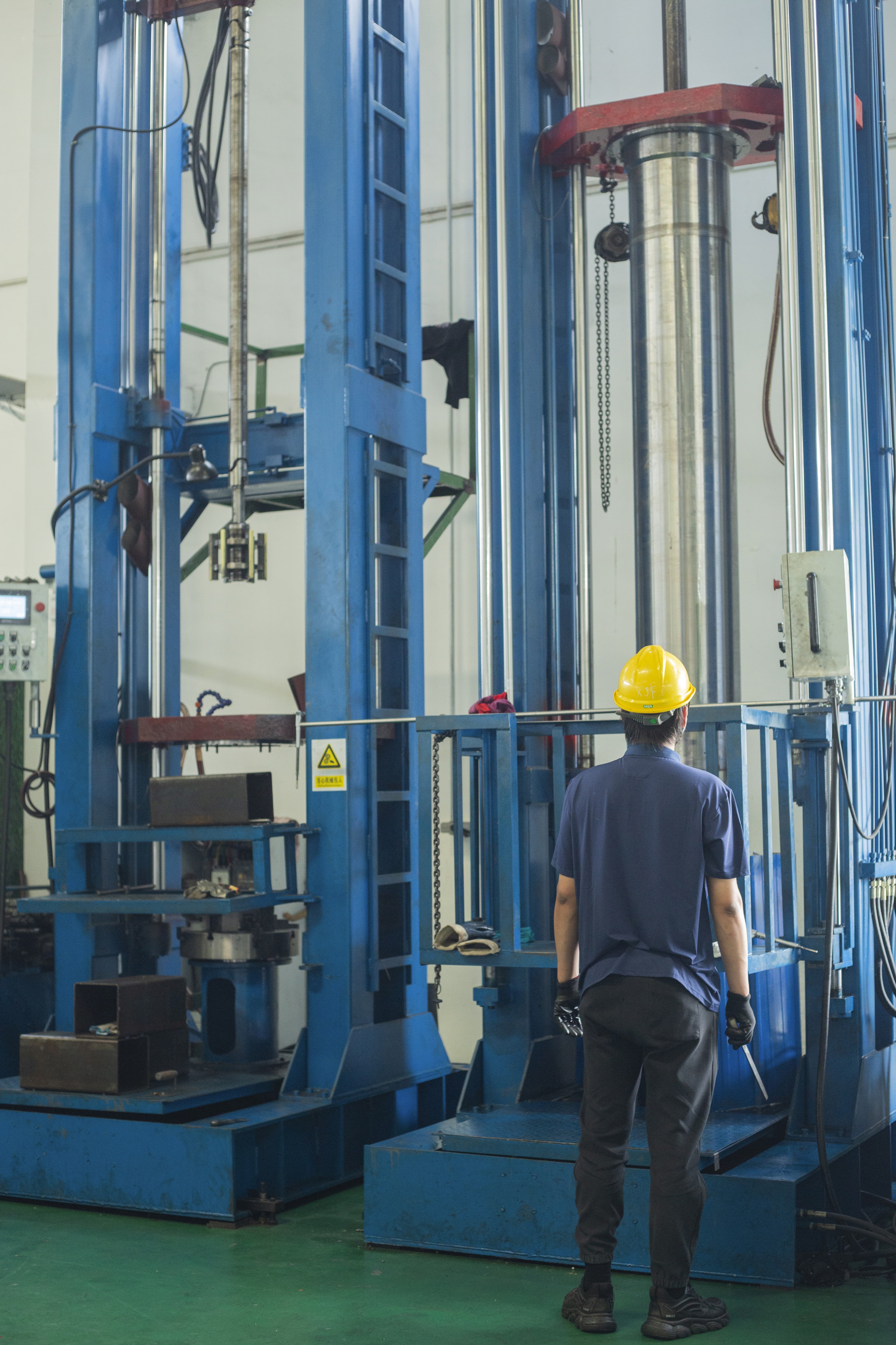 Man in suit smiling in a lit hallway