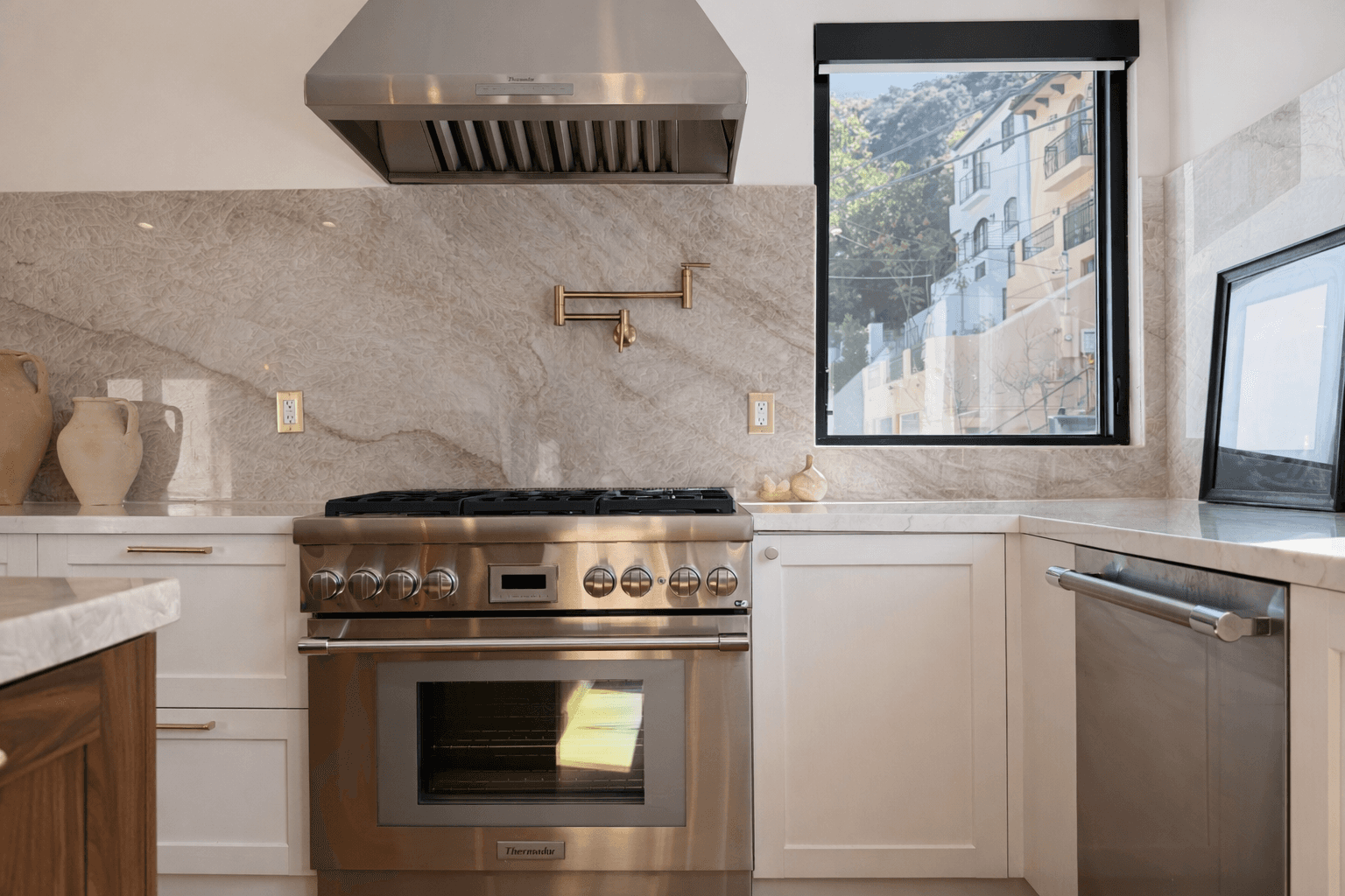 Bright bedroom with colorful bedspread and wall art