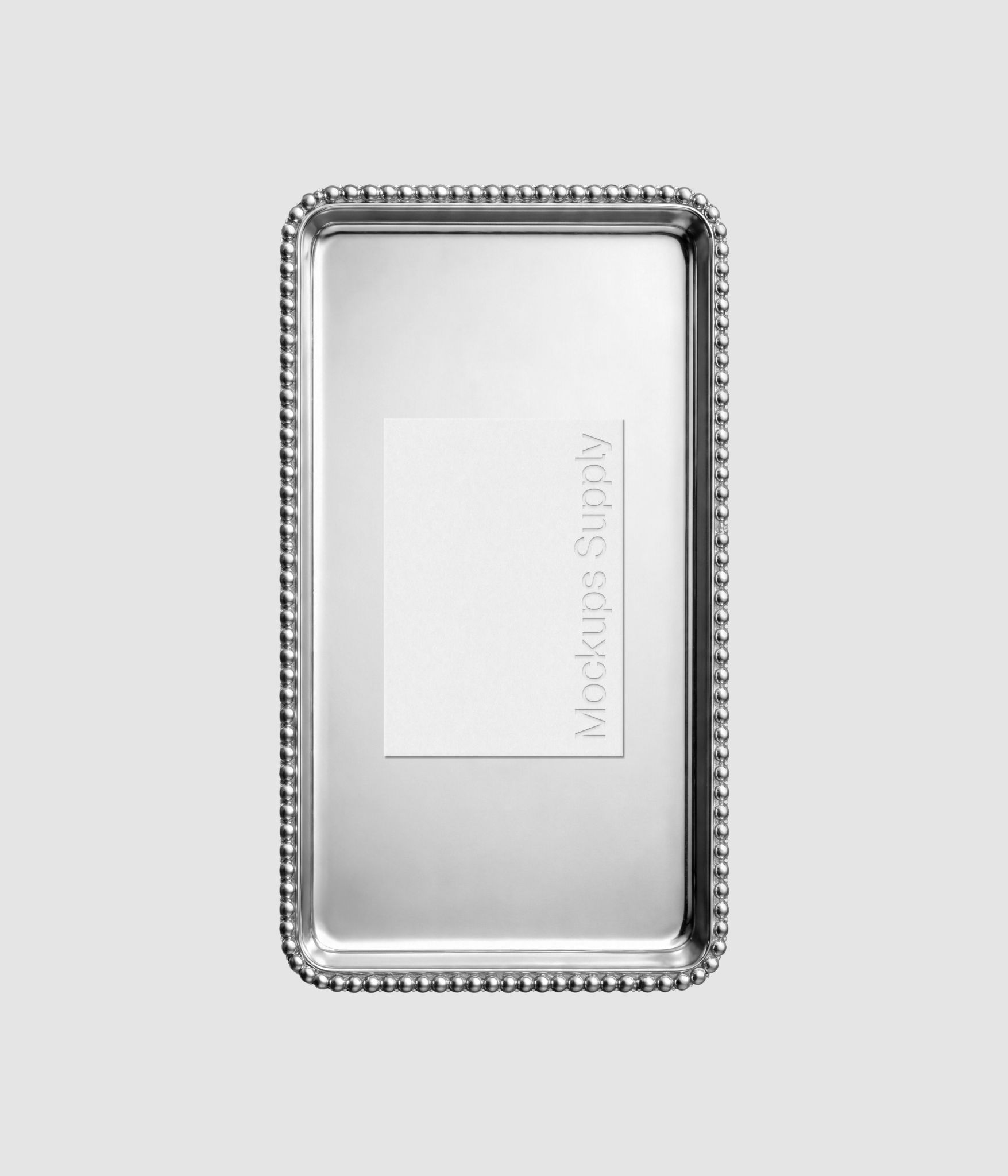 Menu card mockup with embossed typography on antique silver plate for cafe identity and hospitality design showcase