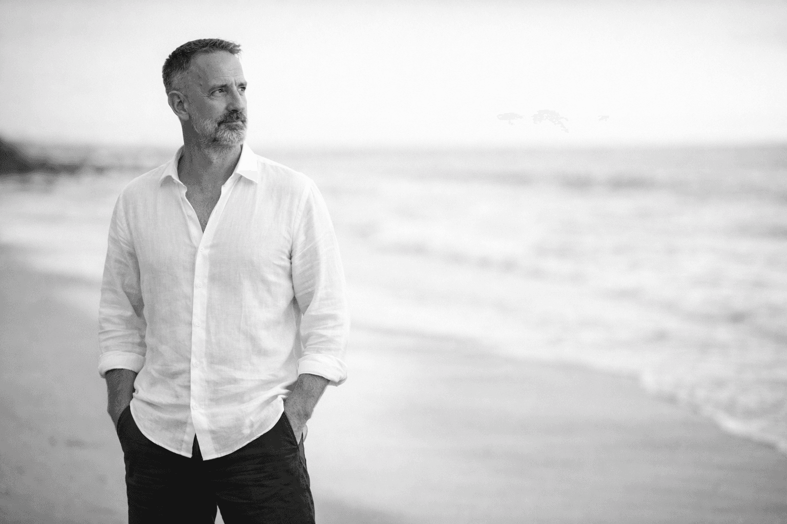 Men and women are sitting at a table.