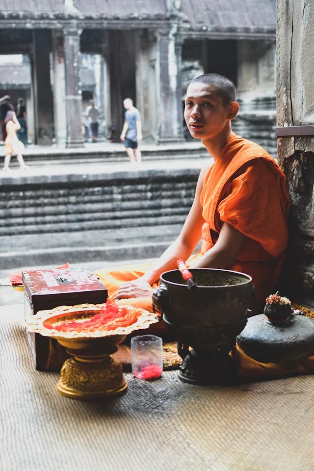Buddhist monk enjoying a simple vegetarian meal in silence