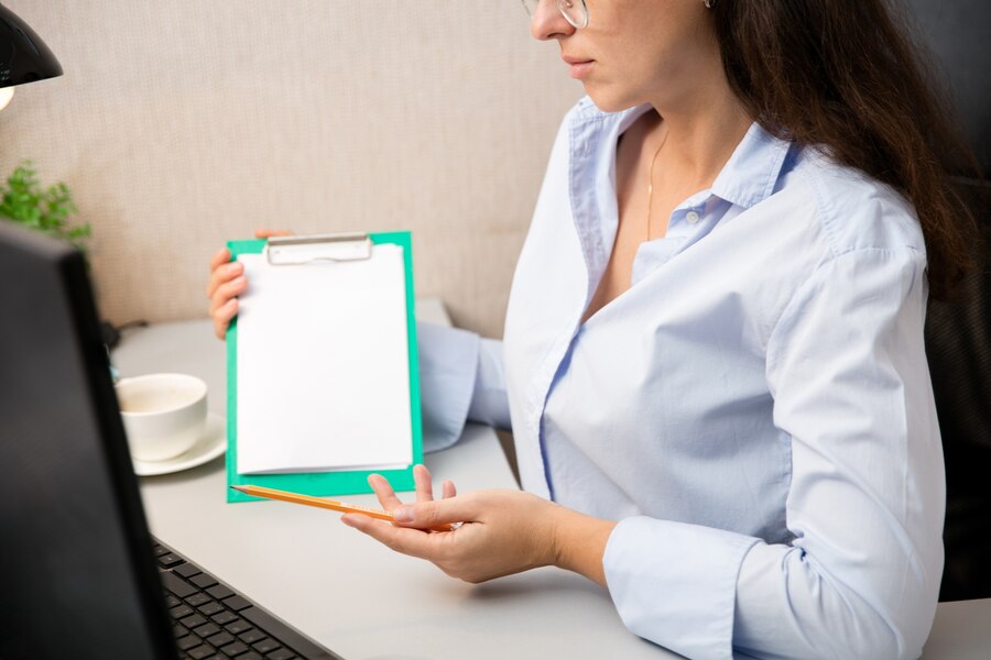 A doctor discussing the report of a patient with them.