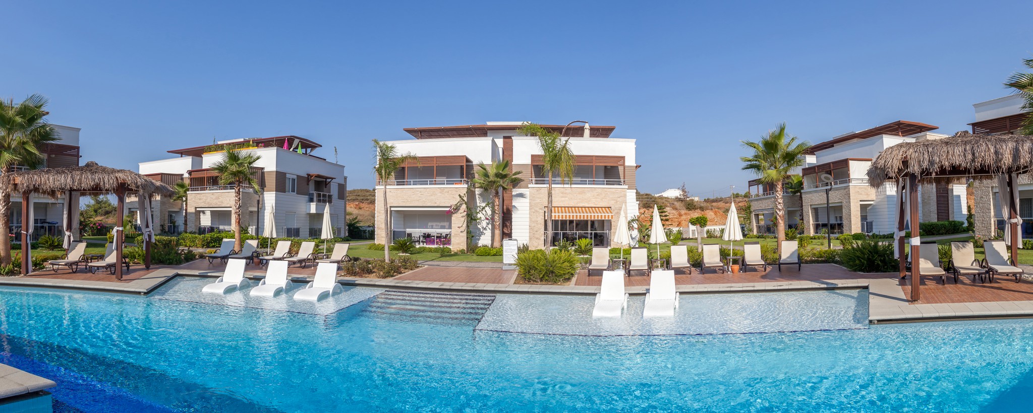 a person walking on the beach at sunset