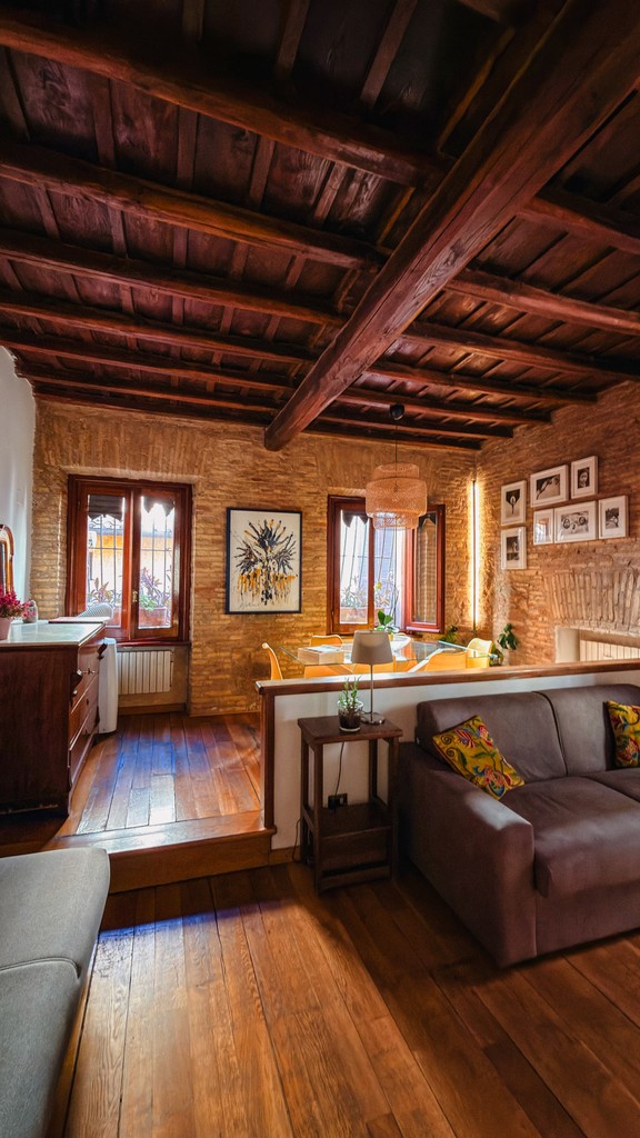 White dining table with green velvet chairs