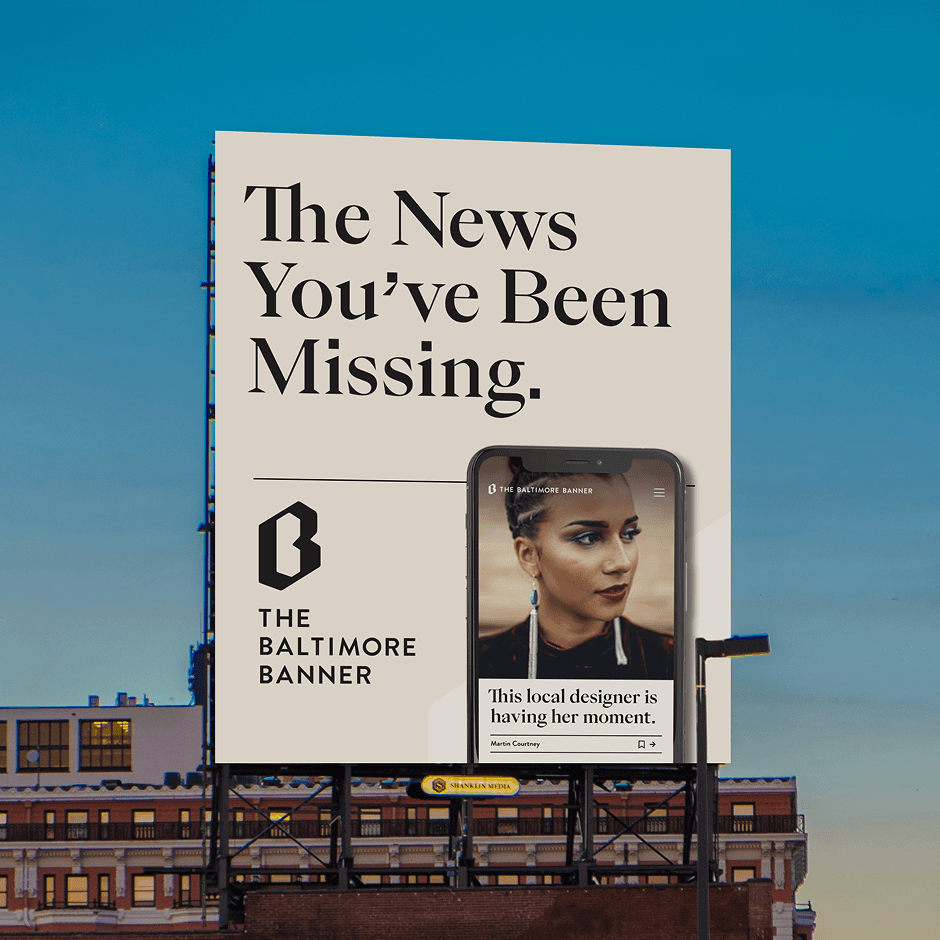 A billboard for The Baltimore Banner displays the slogan "The News You’ve Been Missing" with a smartphone showing a news article about a local designer.