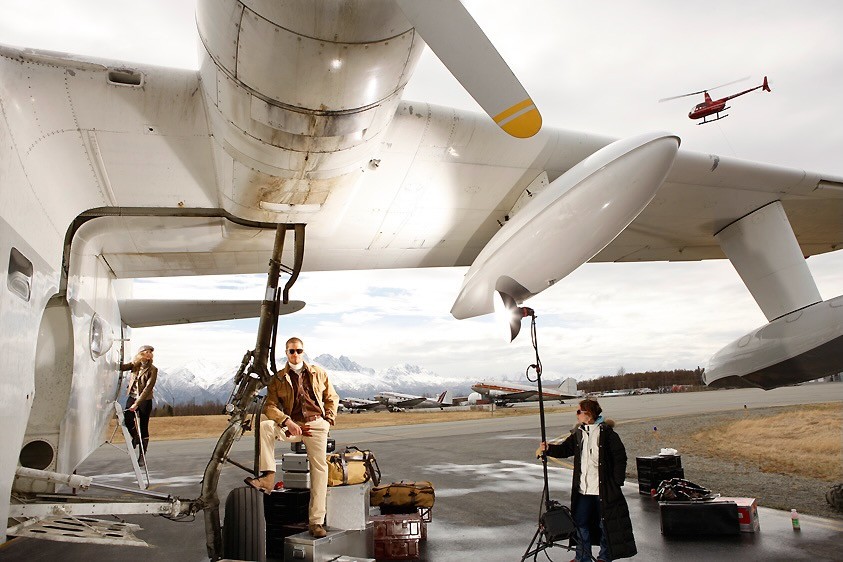 Film crew and equipment positioned beneath an aircraft