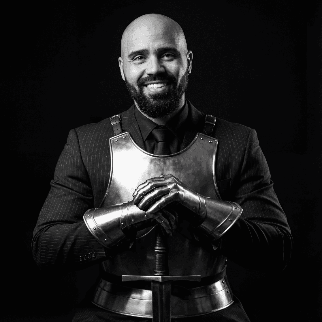 Young woman in a white shirt with a colorful gradient print, against a plain background.
