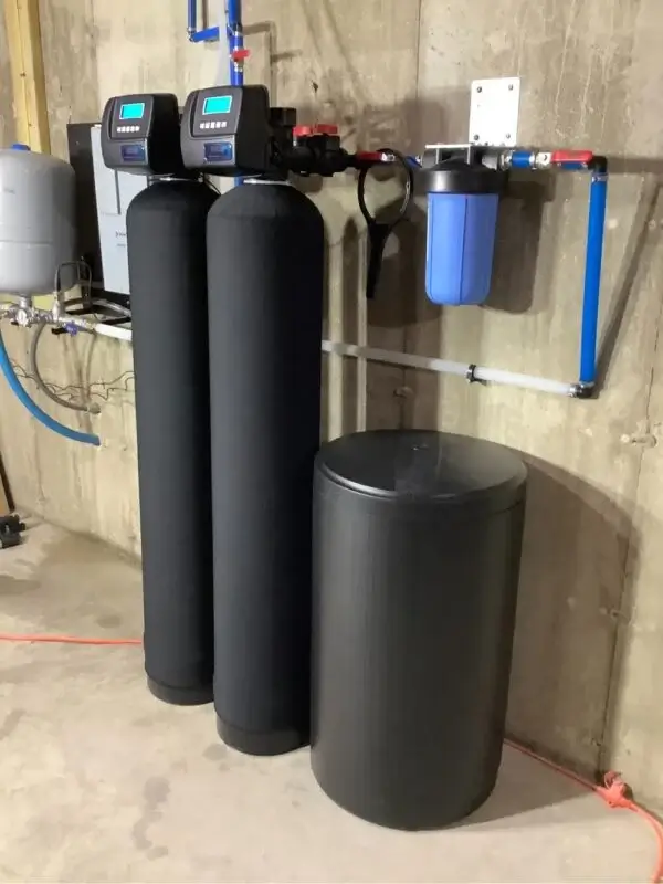 Residential water filtration system installed in Canton, Georgia with dual tanks and sediment filter