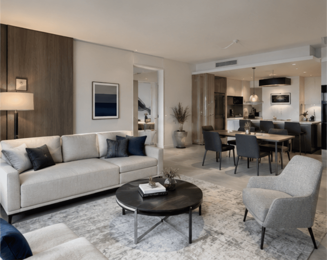 a living room filled with furniture and a large window