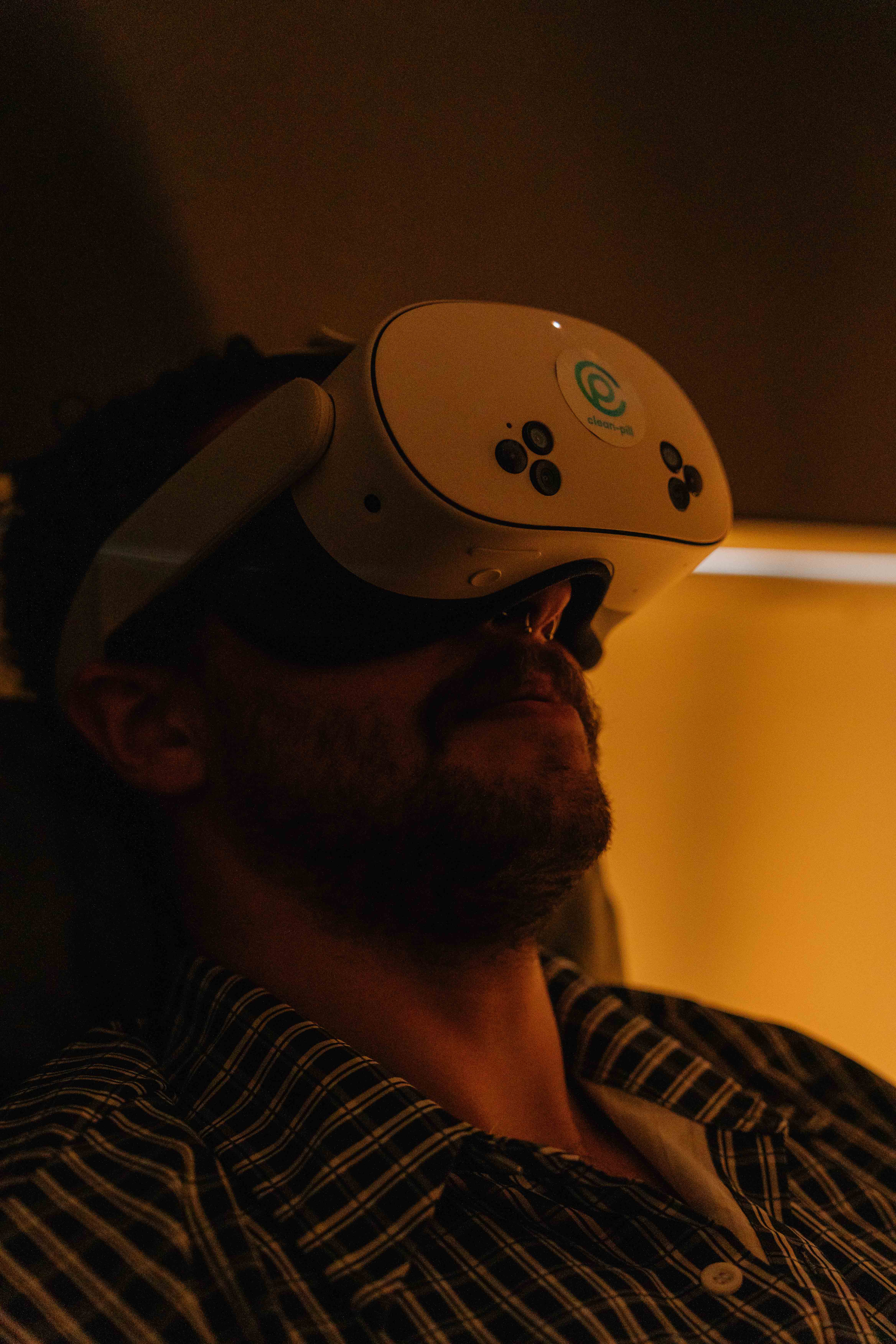 clean-pill Silhouette of a person meditating at sunset, with warm light and tropical plants in the background.