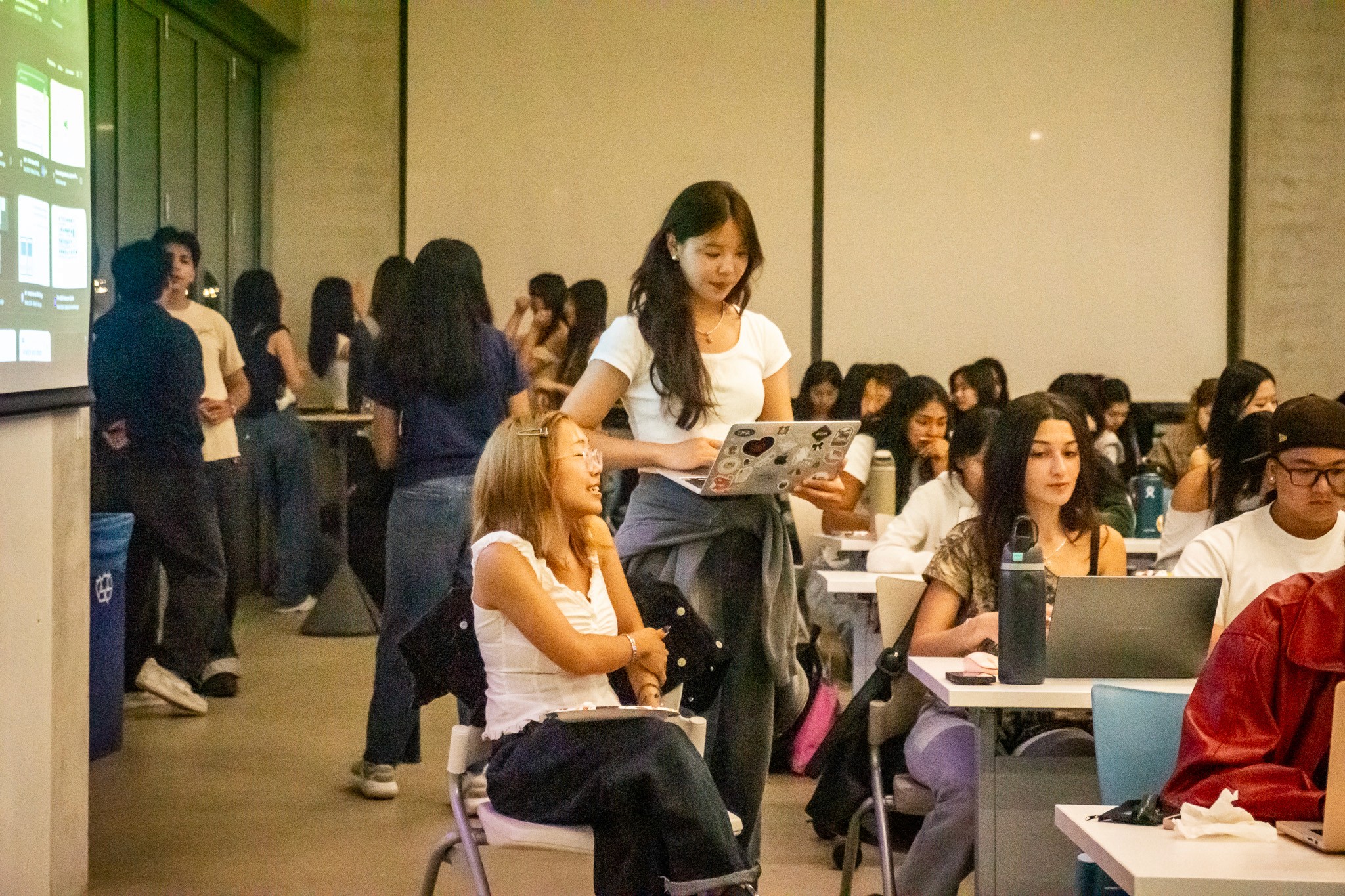 A man stading with Surfboard
