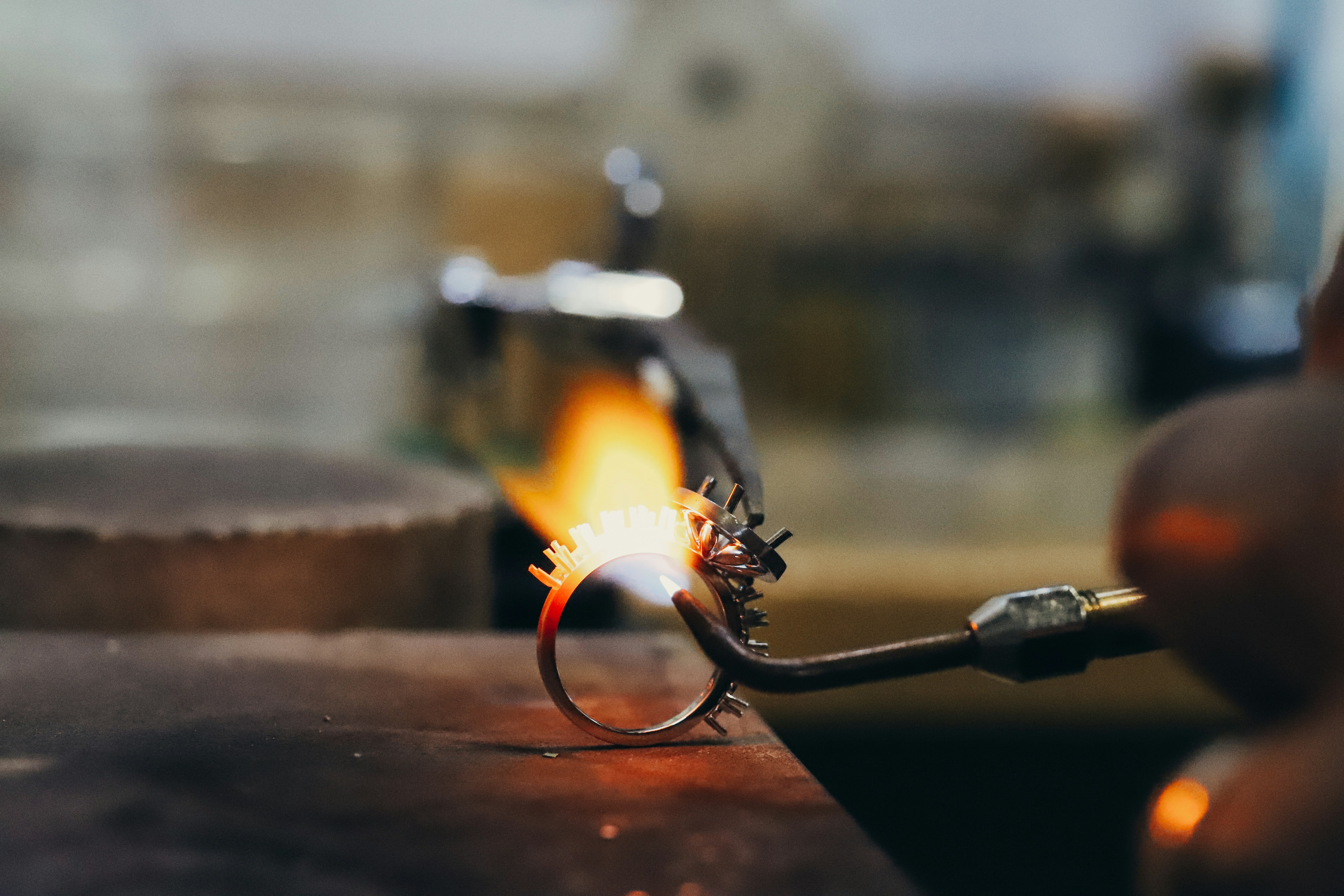 ring with jewellery holding hot flame torch