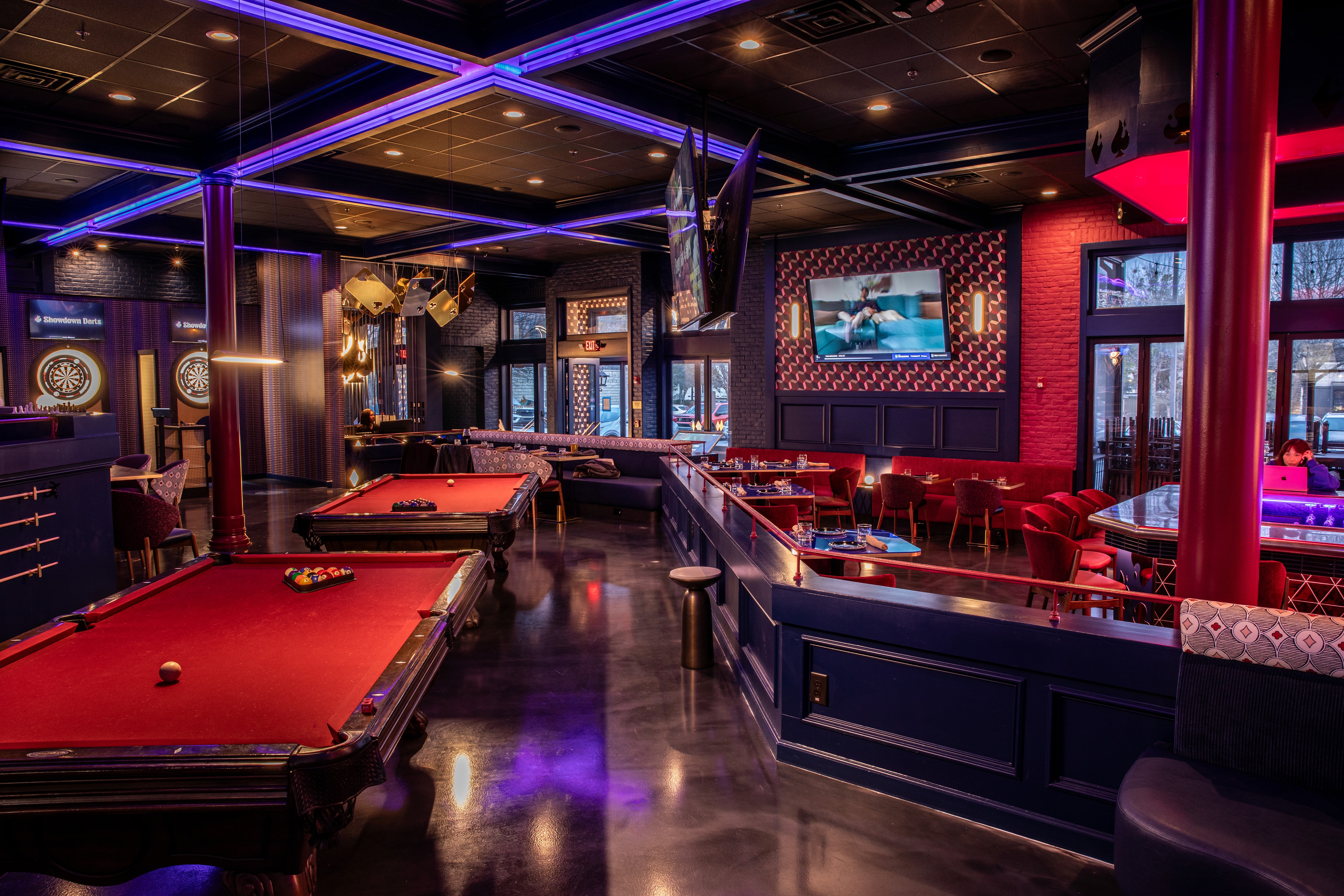 Showdown Social private event area with gaming tables and ambient lighting