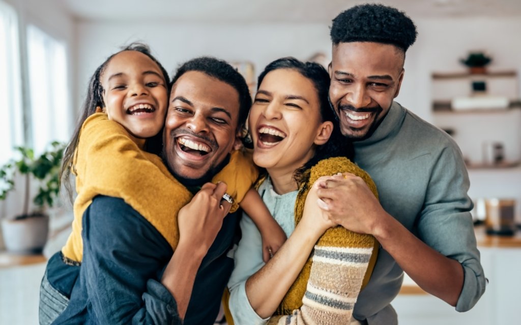 A photo of a happy family holding hands, symbolizing the importance of family reunification and the joy of reuniting with loved ones in the United States.