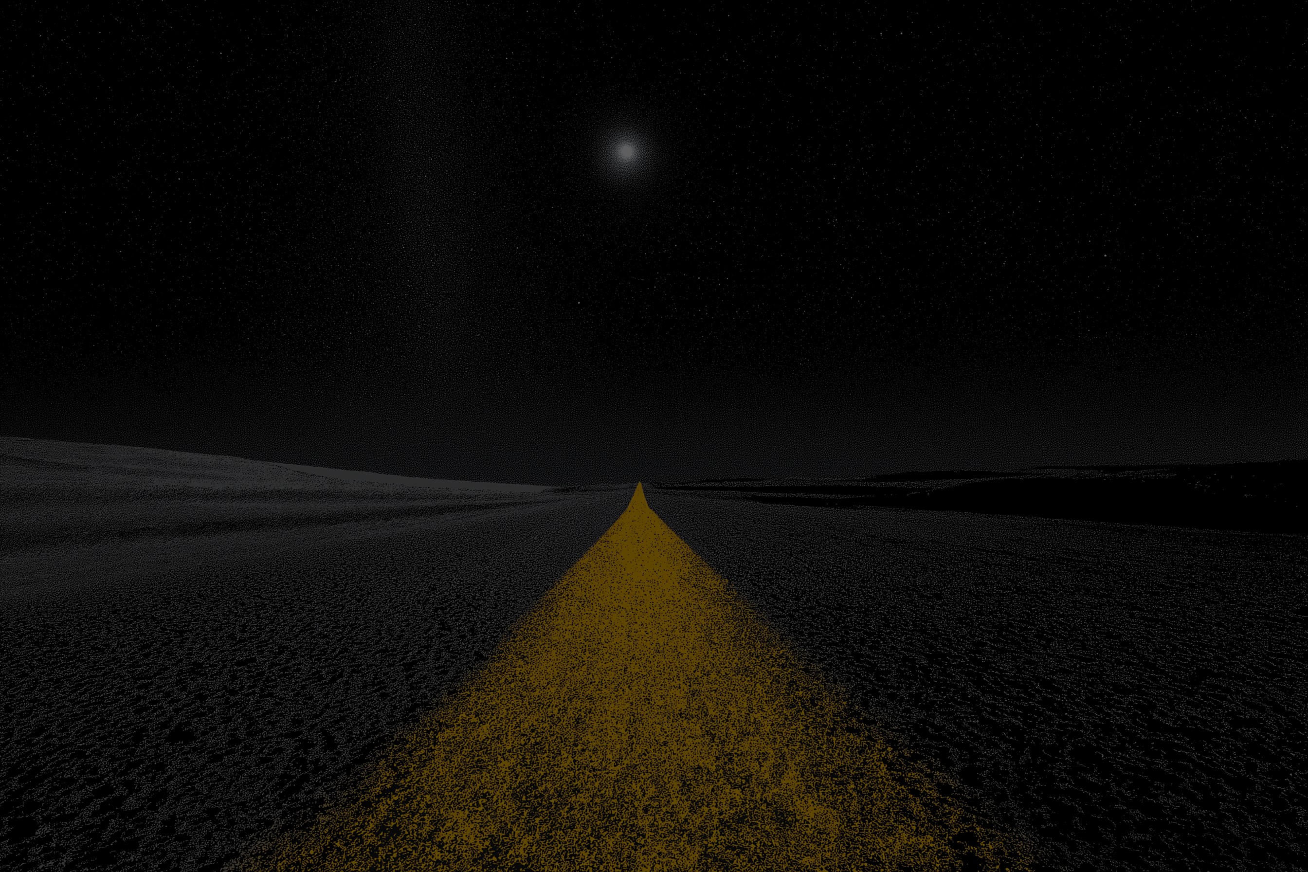 a black and white photo of a street at night