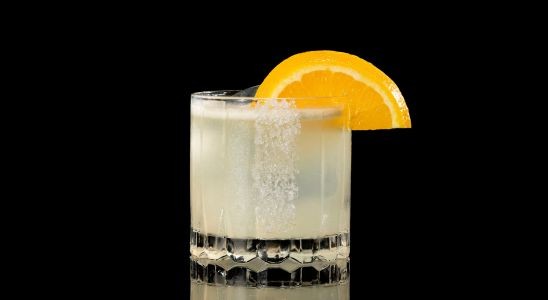 A closeup of a Sour, Year Round NEFT-A-Rita drink against a dark background.