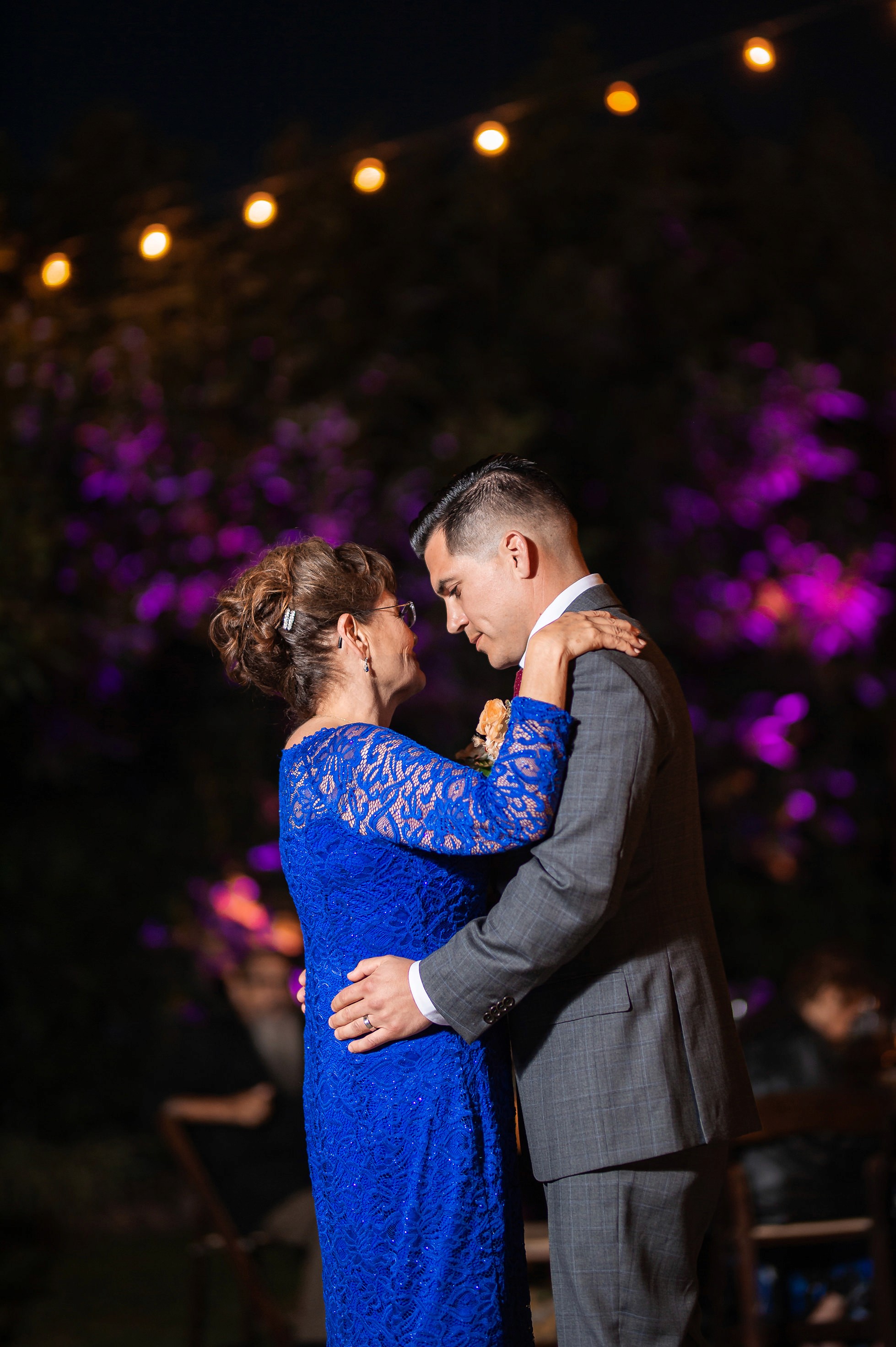 Flat lay wedding details with bouquet, rings, and sparkling bridal heels
