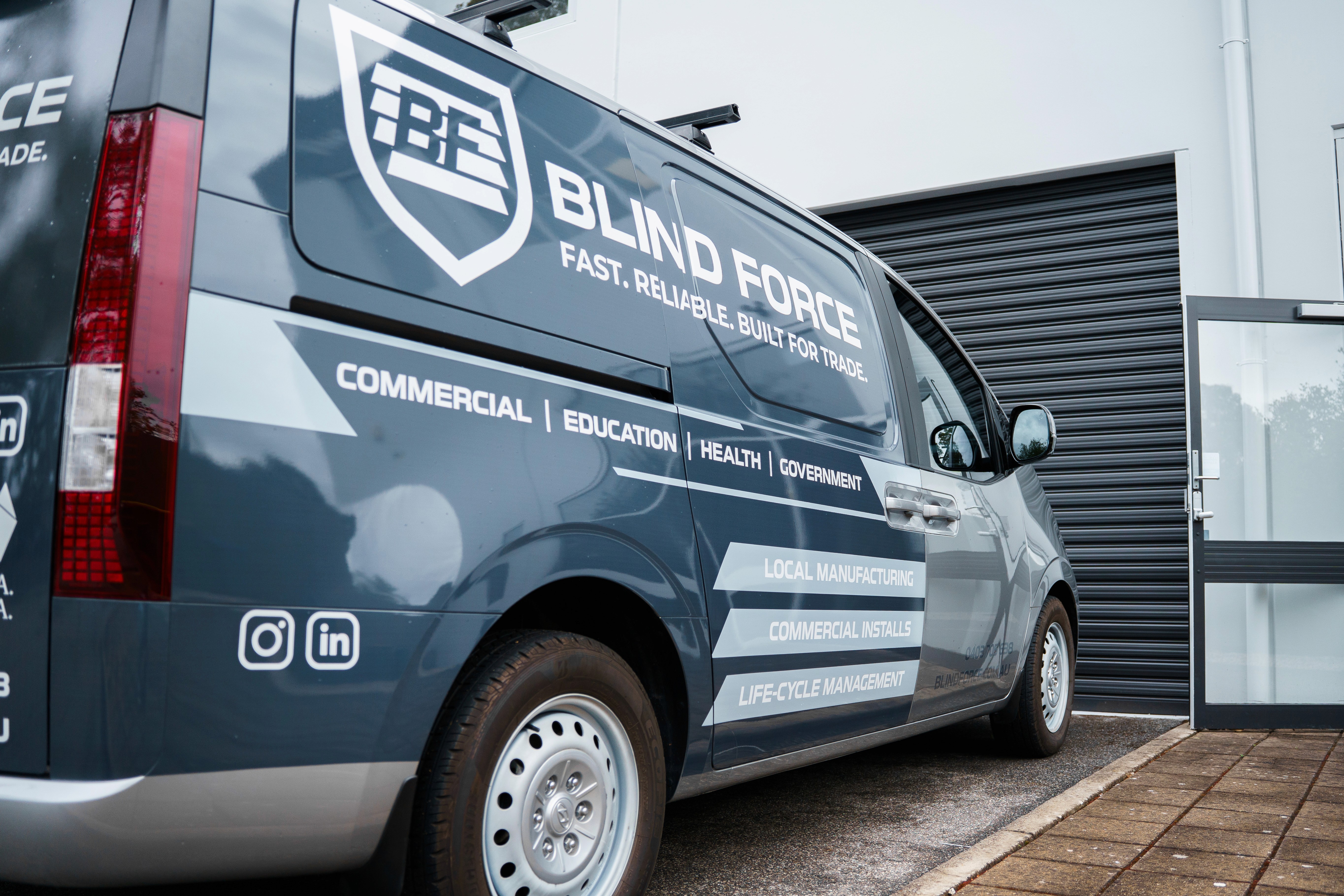 Commercial service van displaying Blind Force logo and contact details