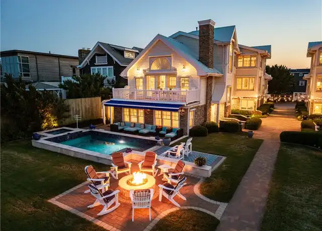Modern house with backyard pool and outdoor fireplace