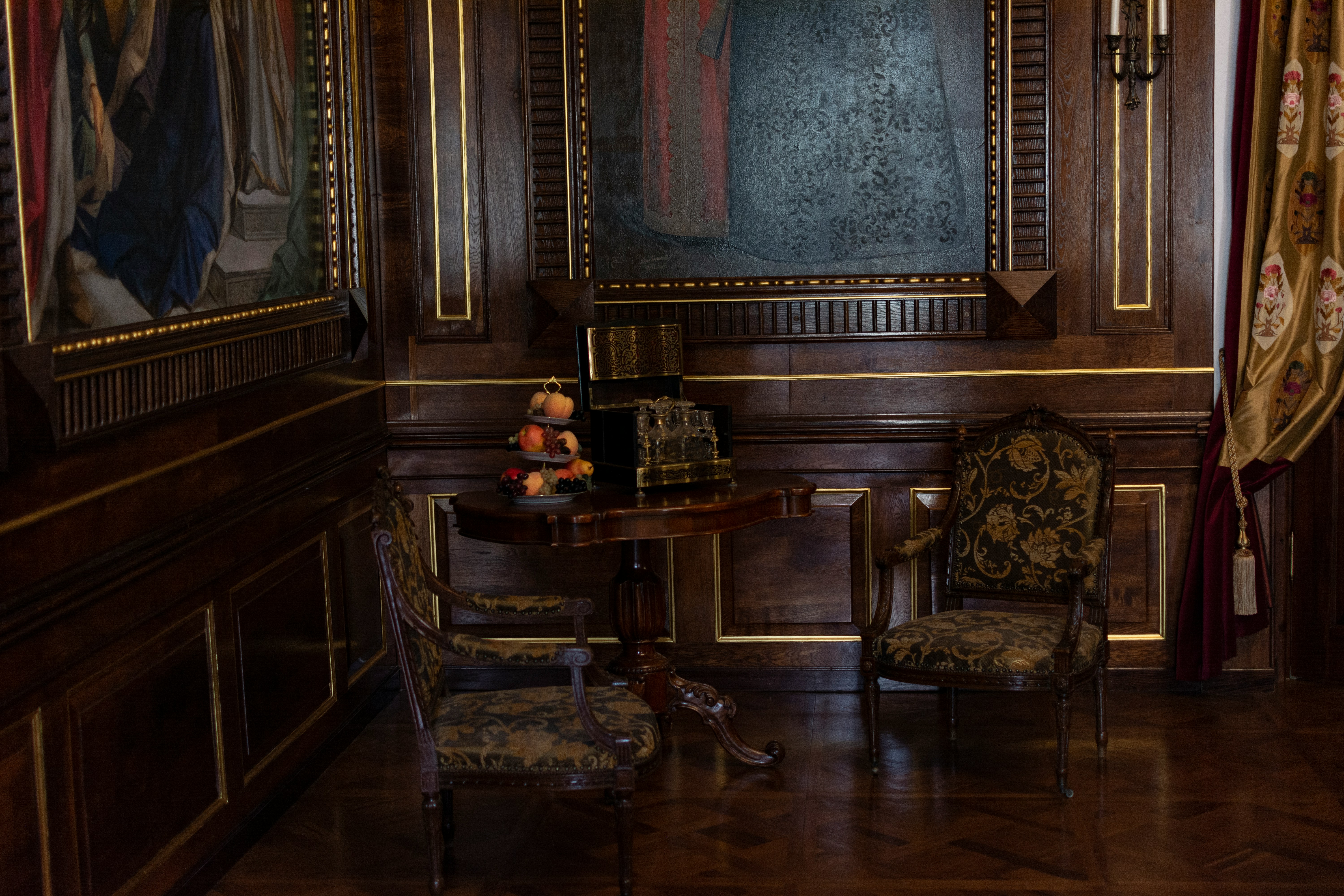 A traditional wooden room with classic furnishings.