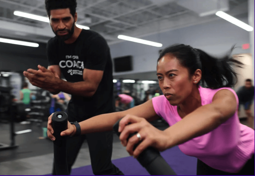 a man holding a wallet and a watch