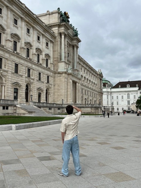 a blurry photo of a person standing in front of a wall