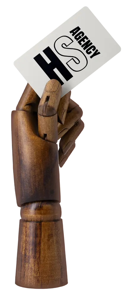 Wooden carved hand holding business card