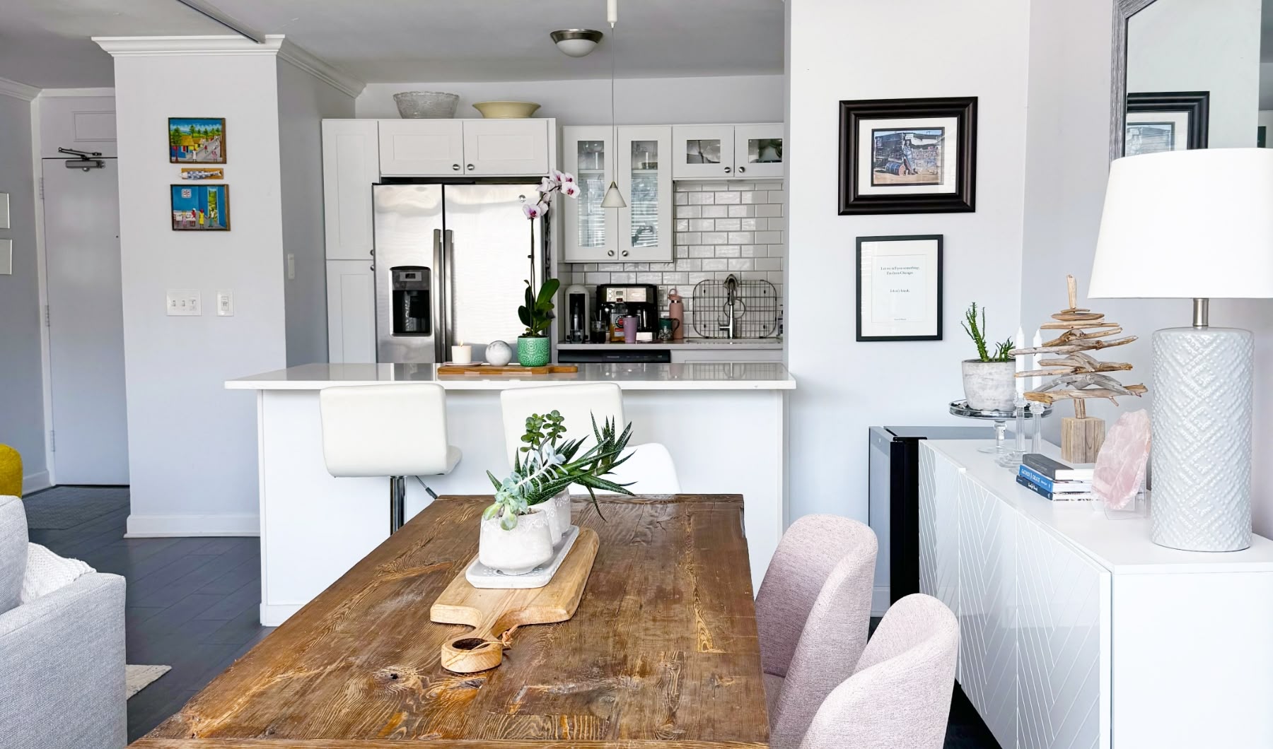 modern clean colorful dining room with table and kitchen view