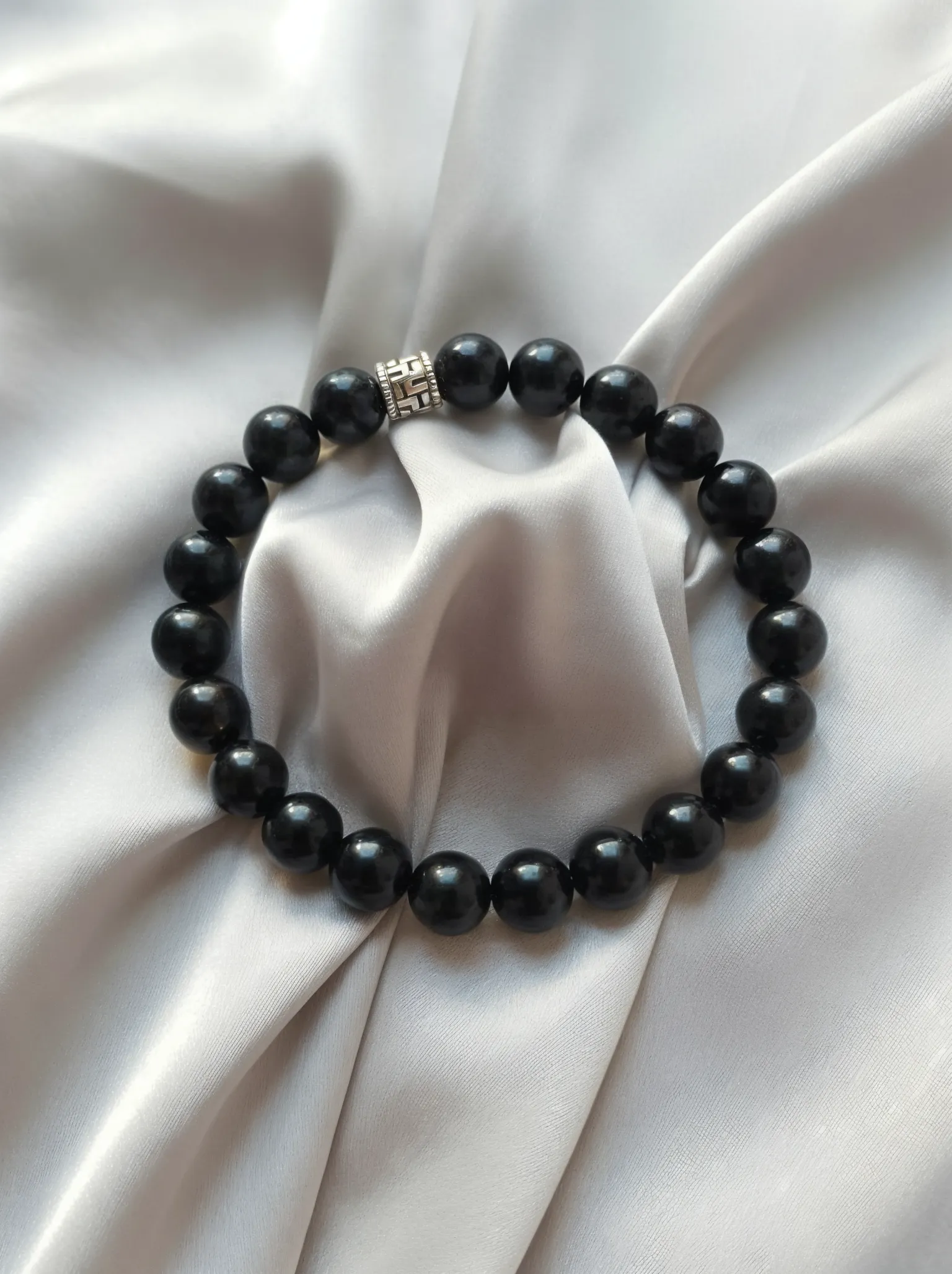 Bracelet placed on a fabric setting.