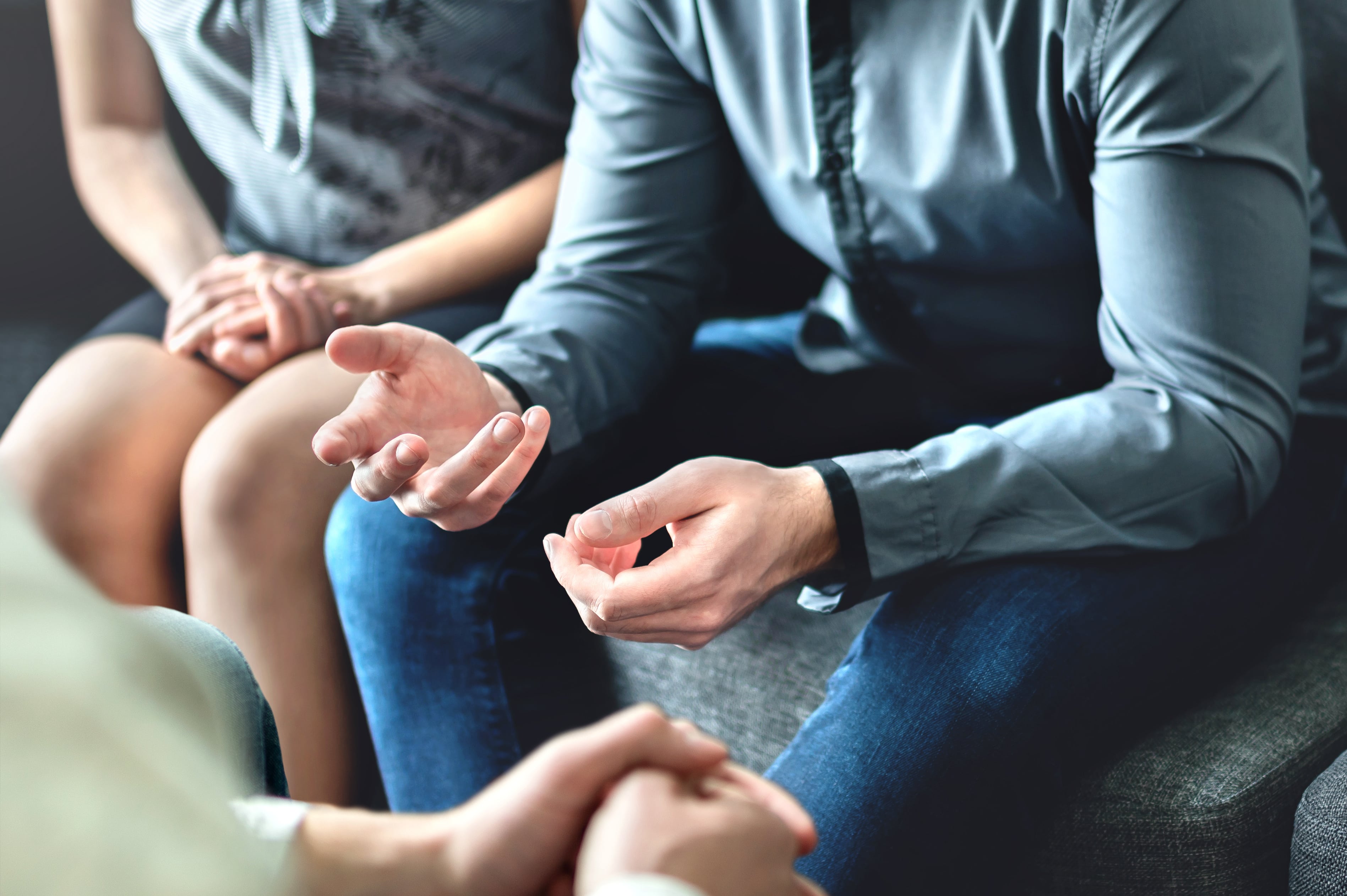 Three people in counselling together 