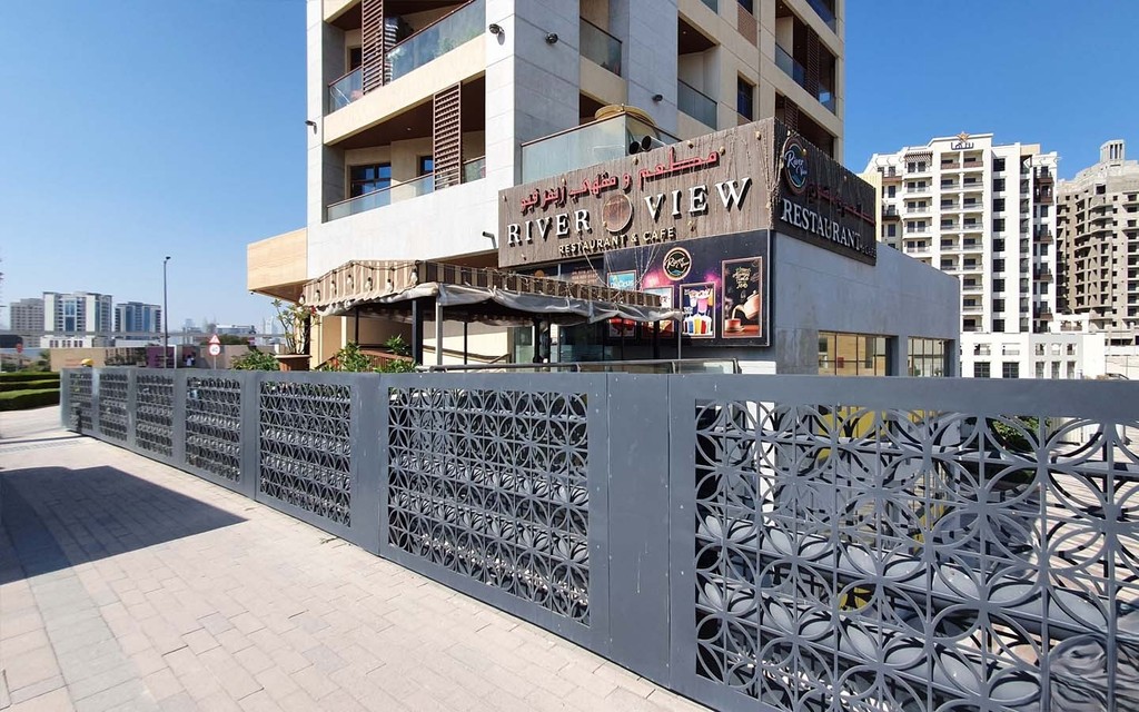 River View Restaurant & Cafe in Al Jaddaf with Arabic signage, outdoor seating, and modern urban surroundings.